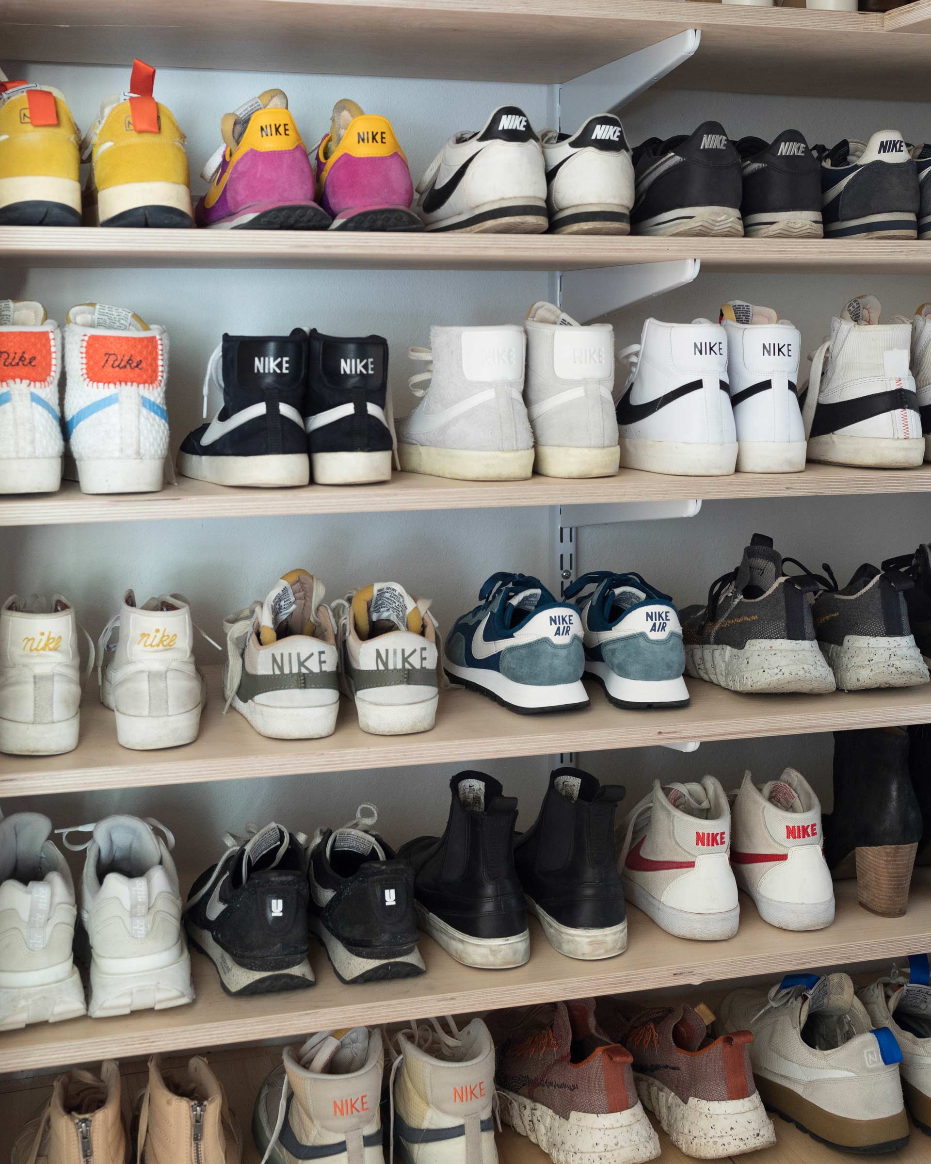 A sneaker wall of Nike shoes. 