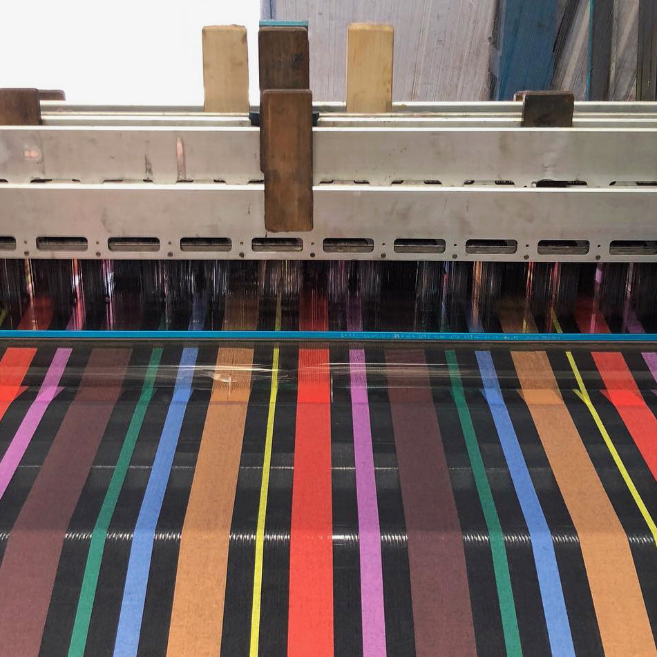 close-up of a machine and strips of colors