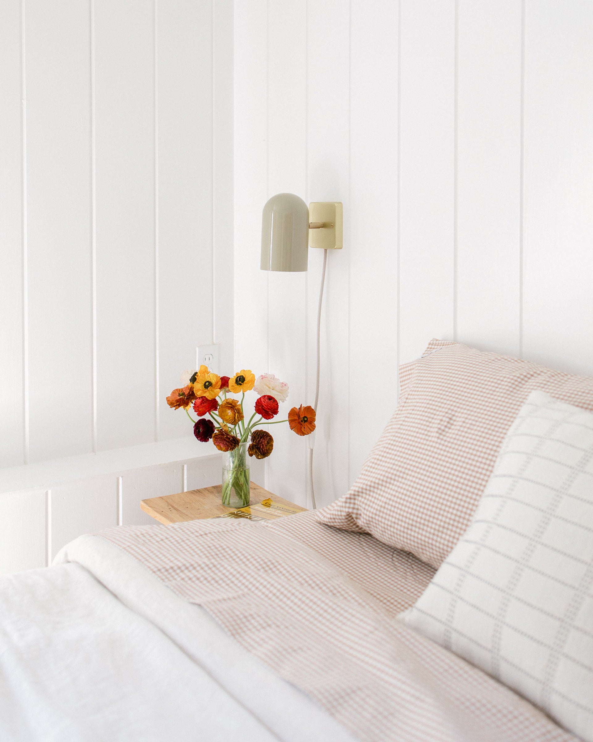 The Allegheny plug-in wall sconce in a bedroom.
