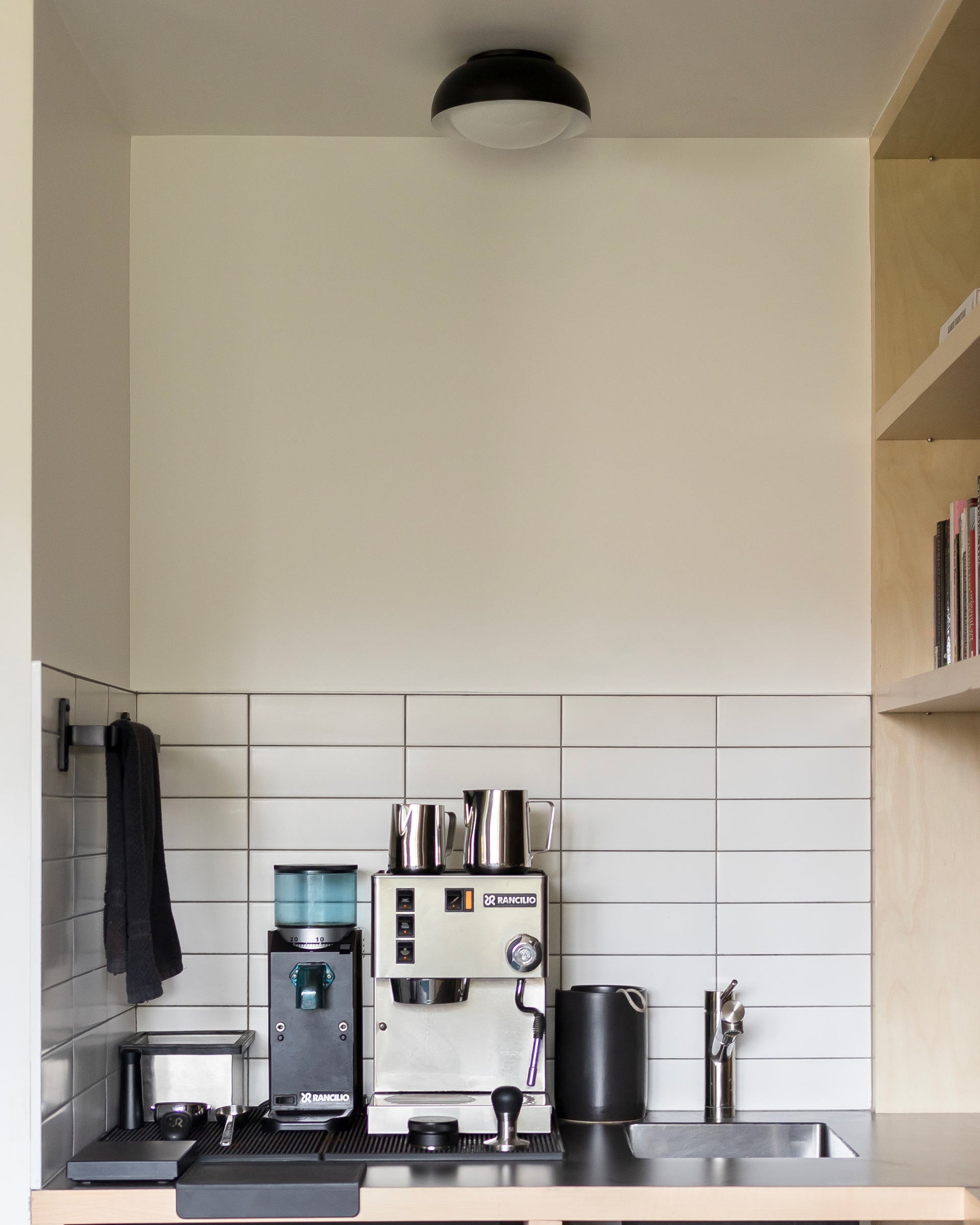 An at-home coffee station with an espresso machine. 