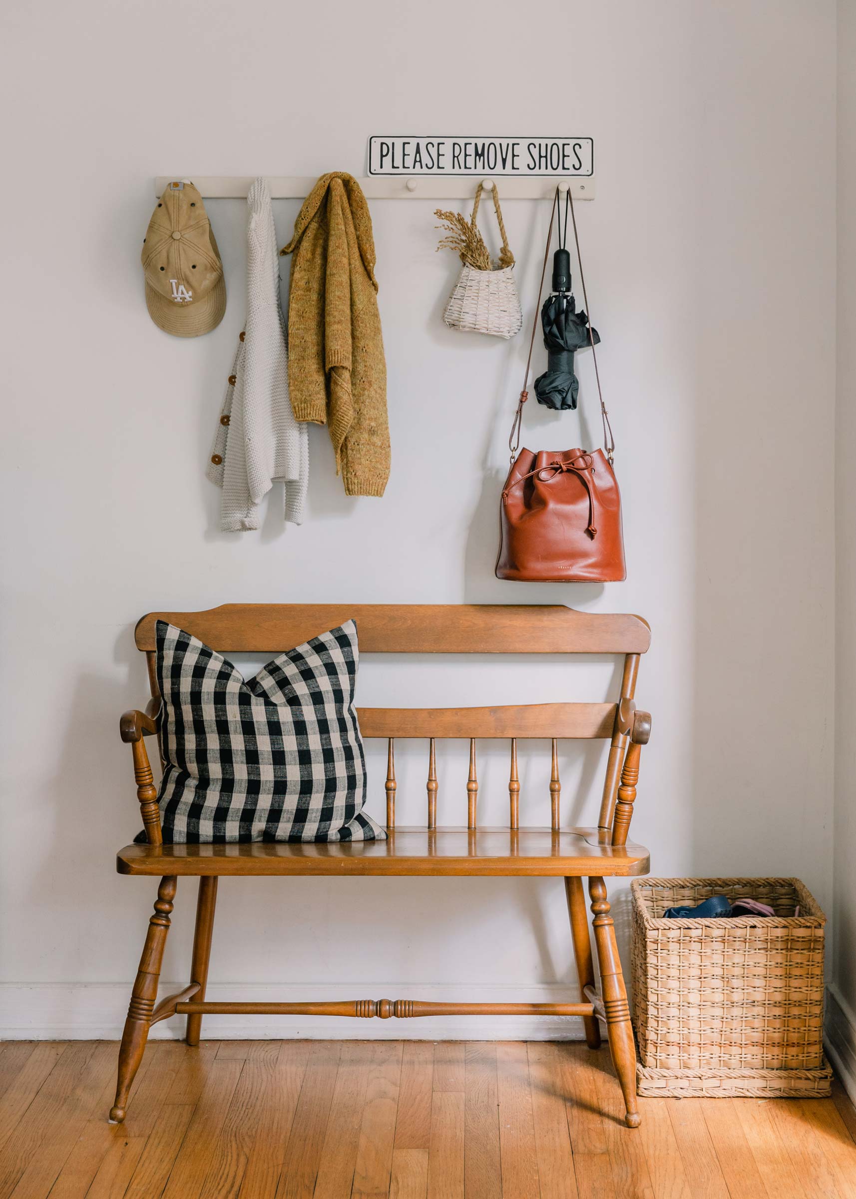 An entryway bench with a peg rail for storage. 