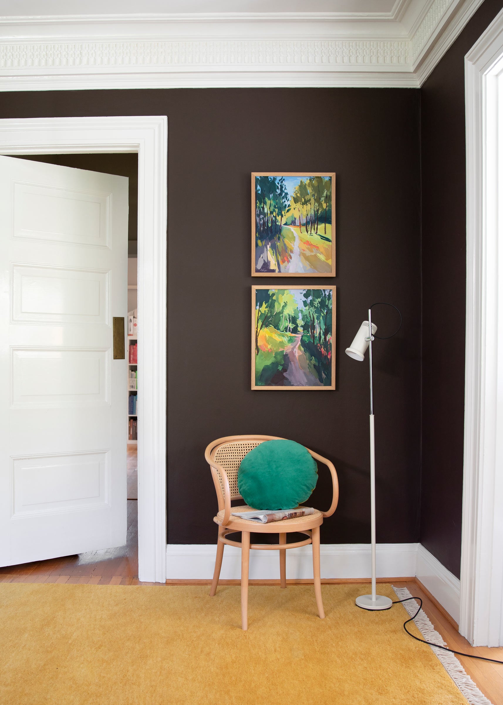 An art wall in a cozy living room nook.