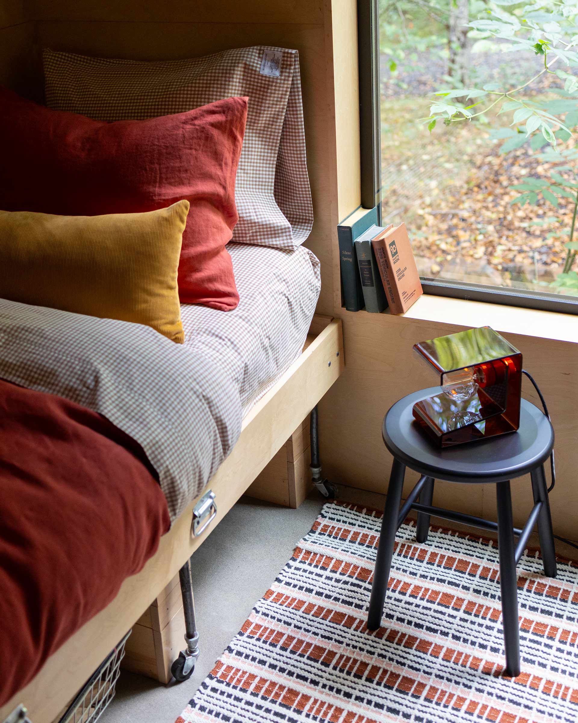 Bedding in a cozy modern cabin.
