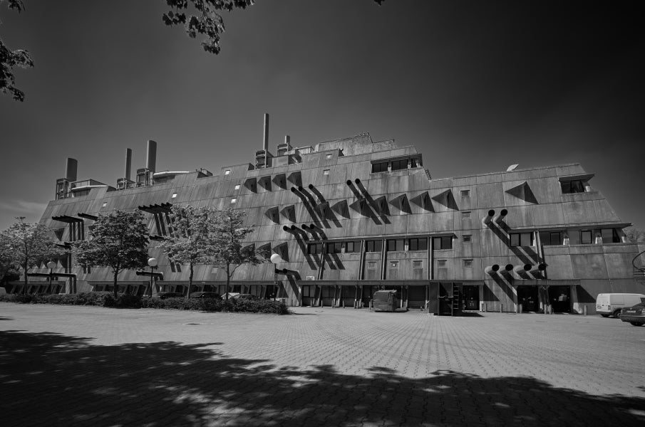 large building with a parking lot in front of it