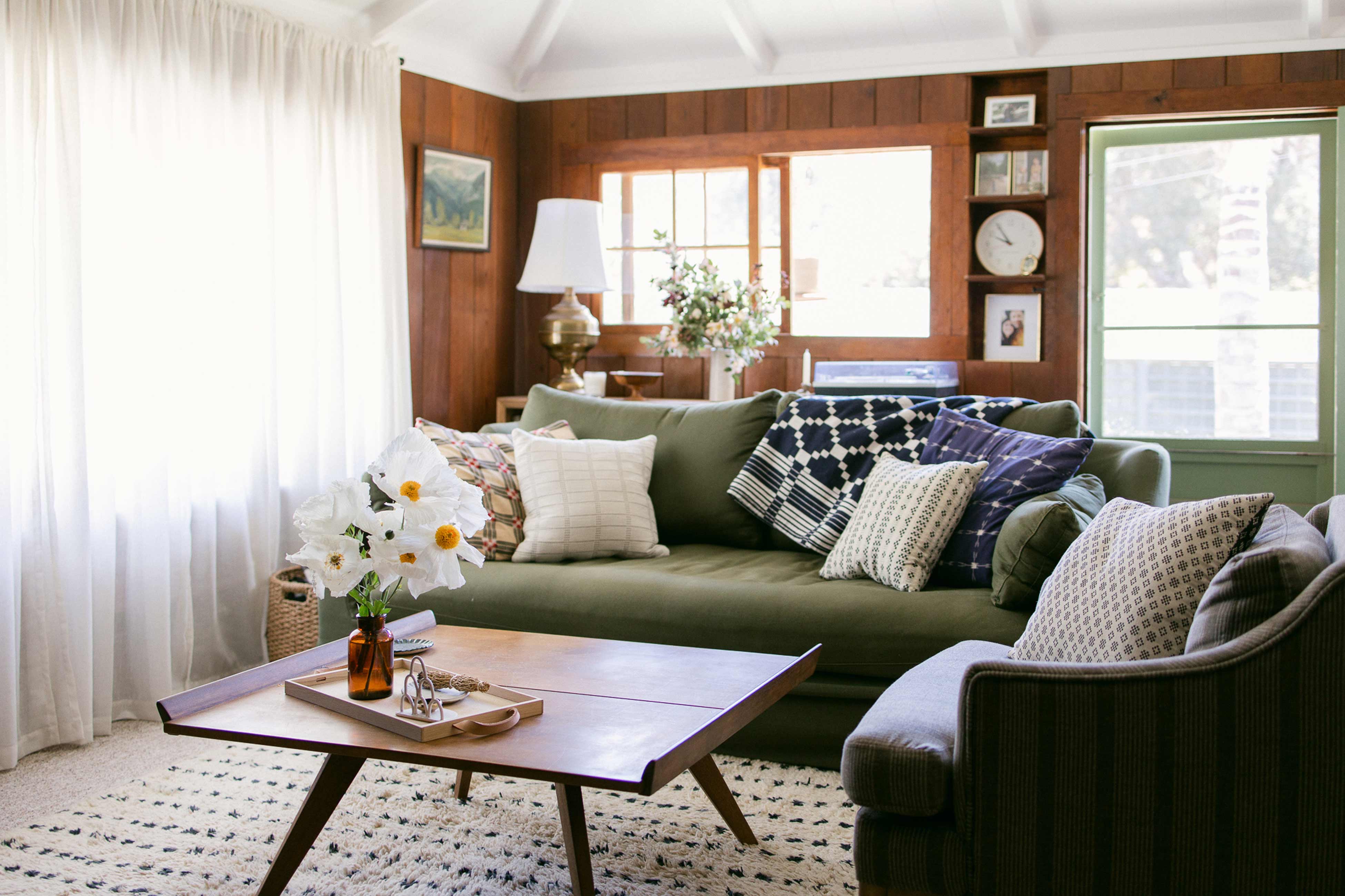 Bright living room with green couch.