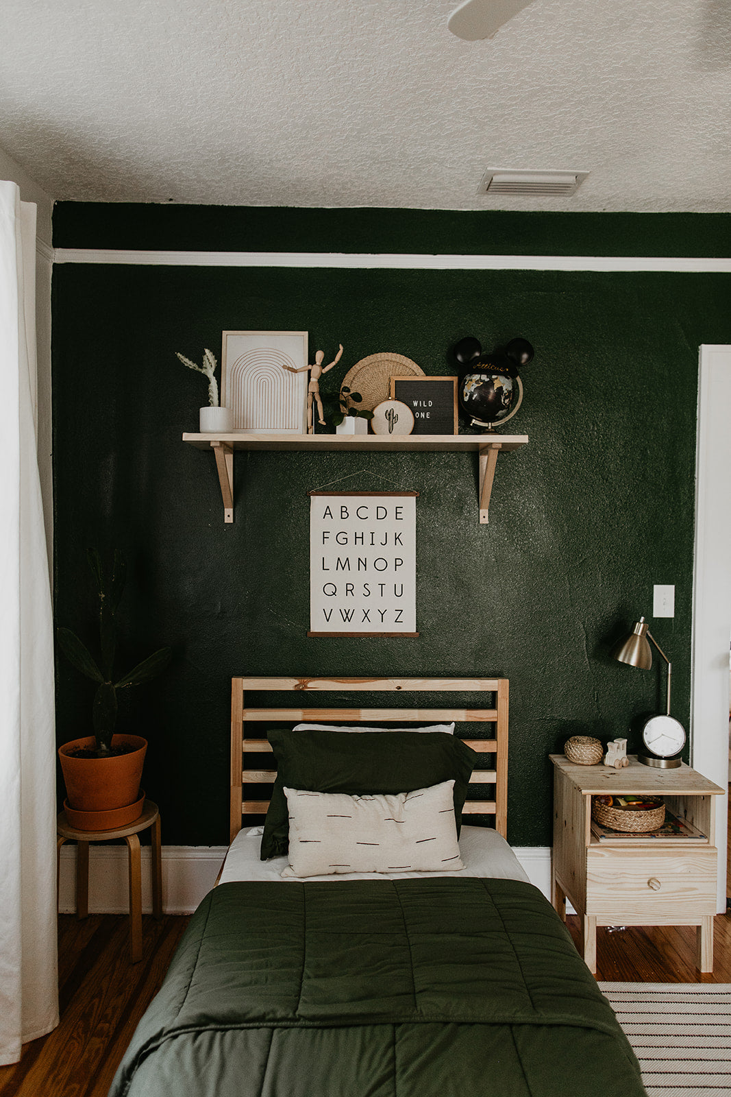 bedroom with bed with dark bed spread