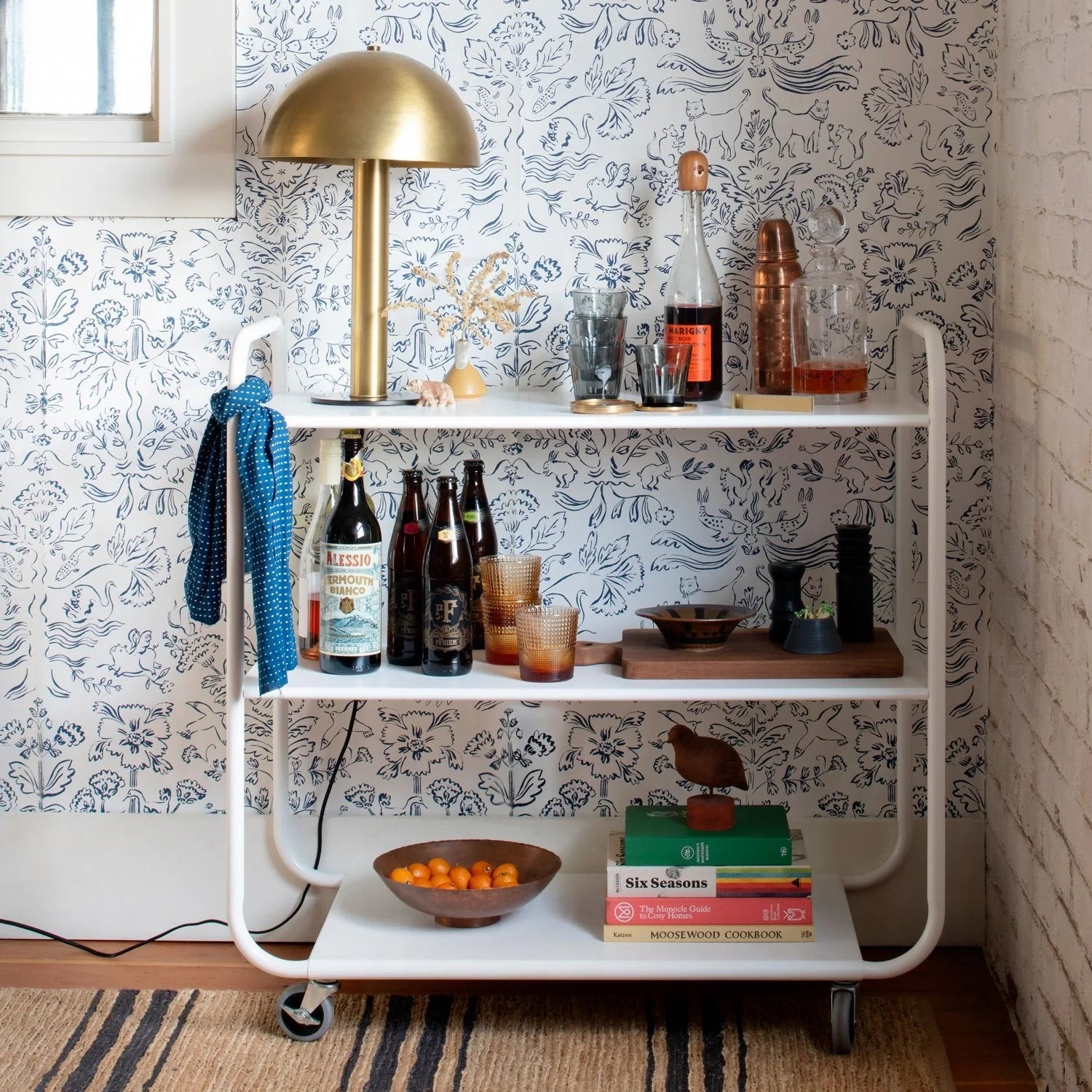 Metal utility cart styled with bar things. 