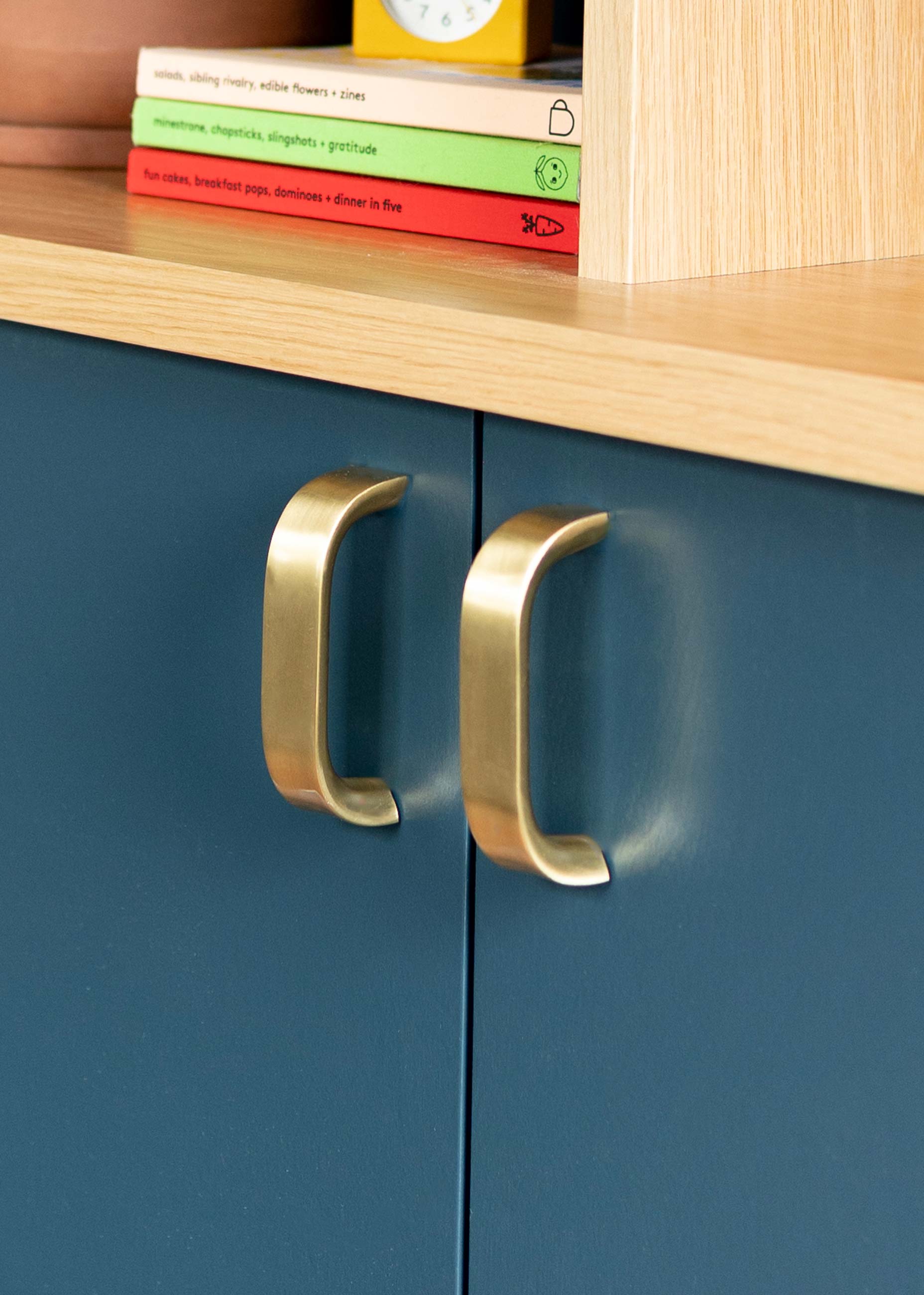 Up close shot of brass pulls on a cabinet. 