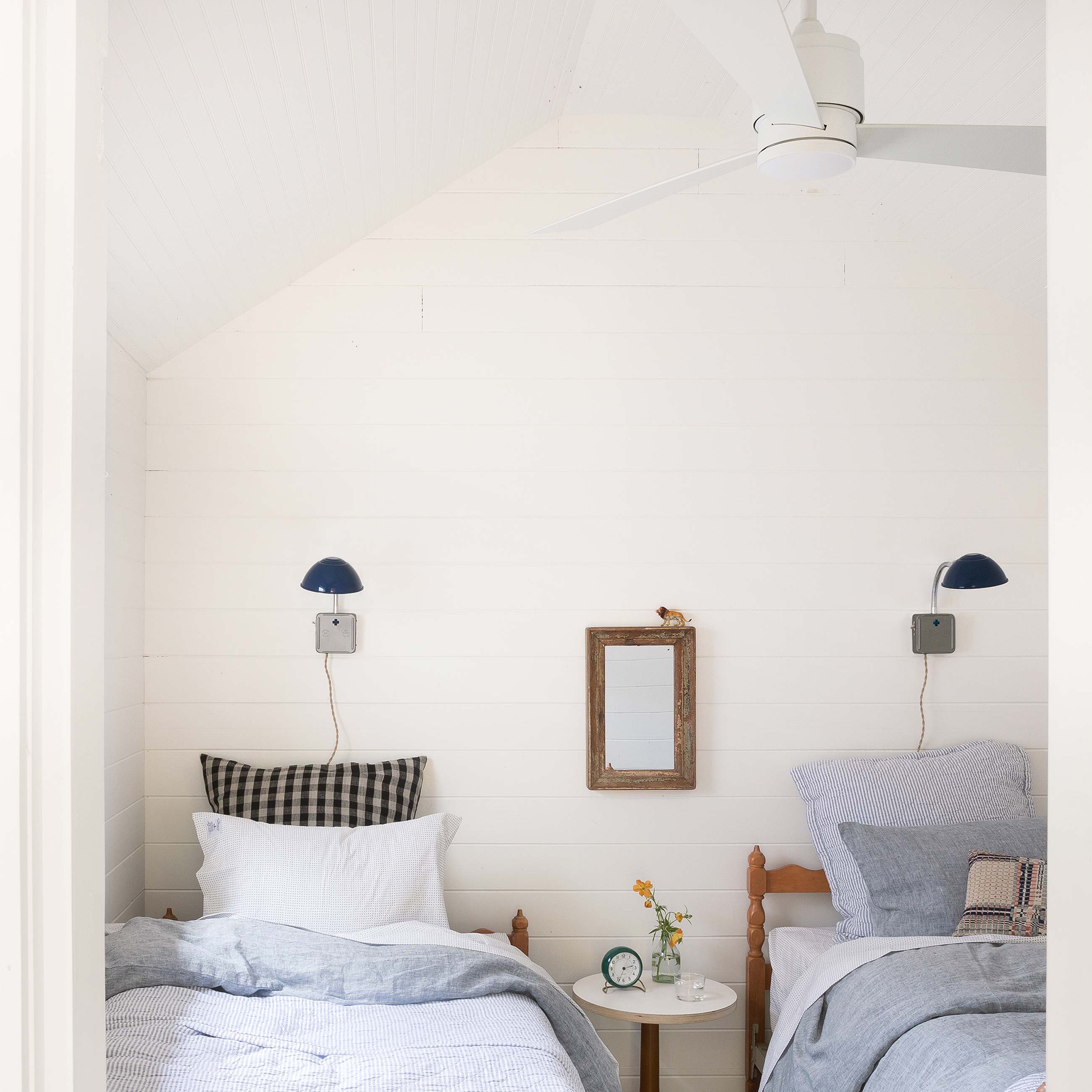 white modern ceiling fan in bedroom