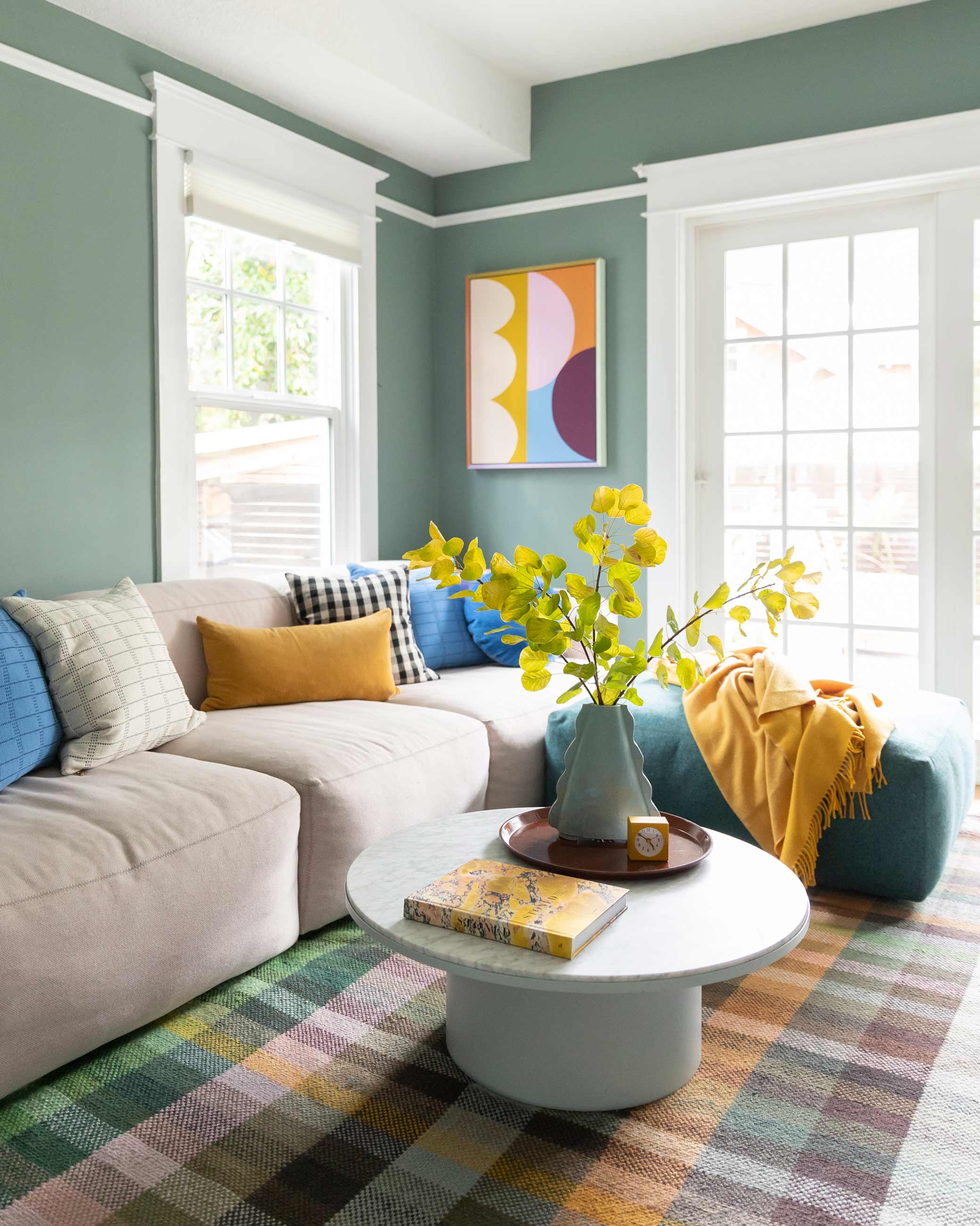 Colorful den with comfy couch.