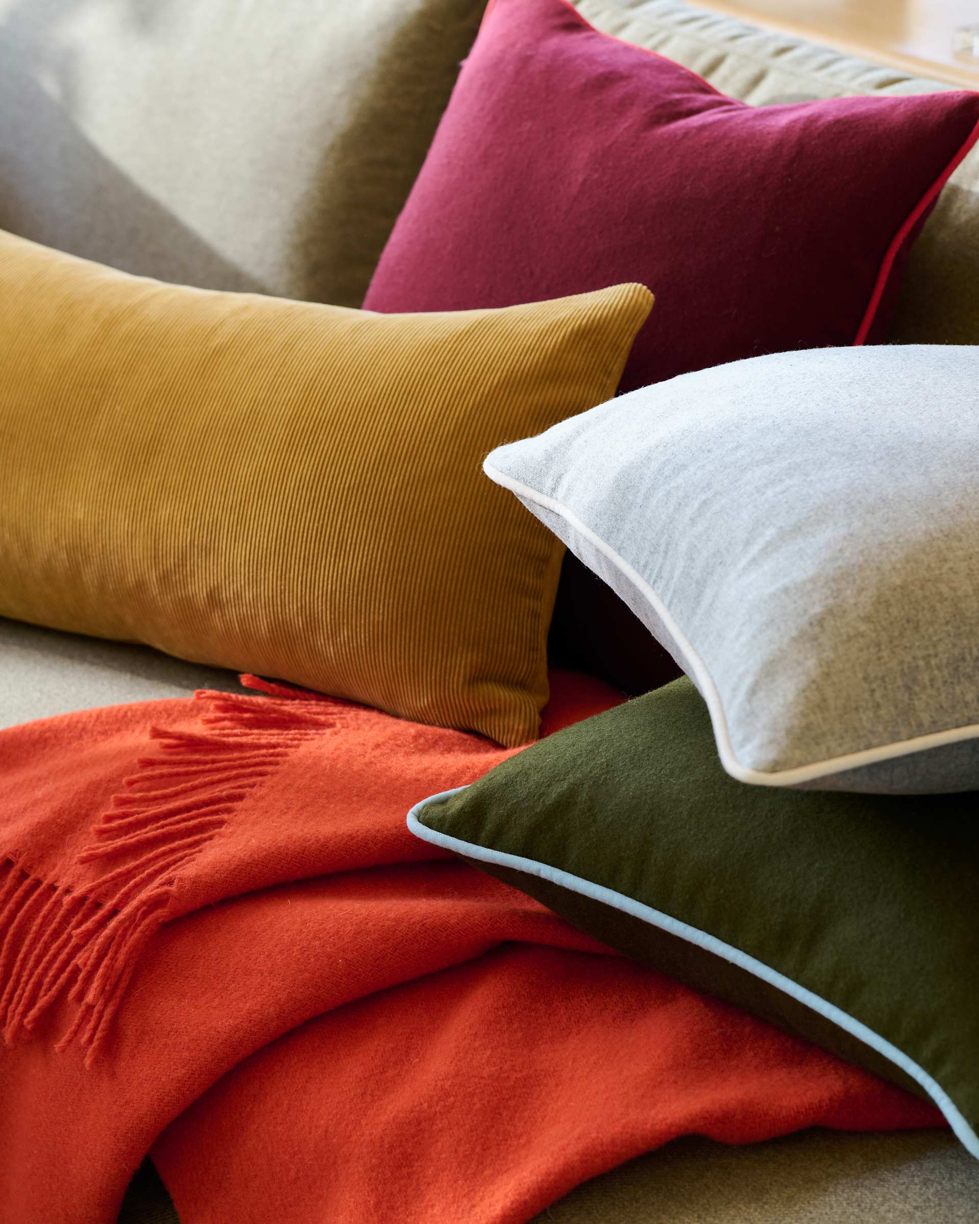 Colorful throw pillows on a couch.