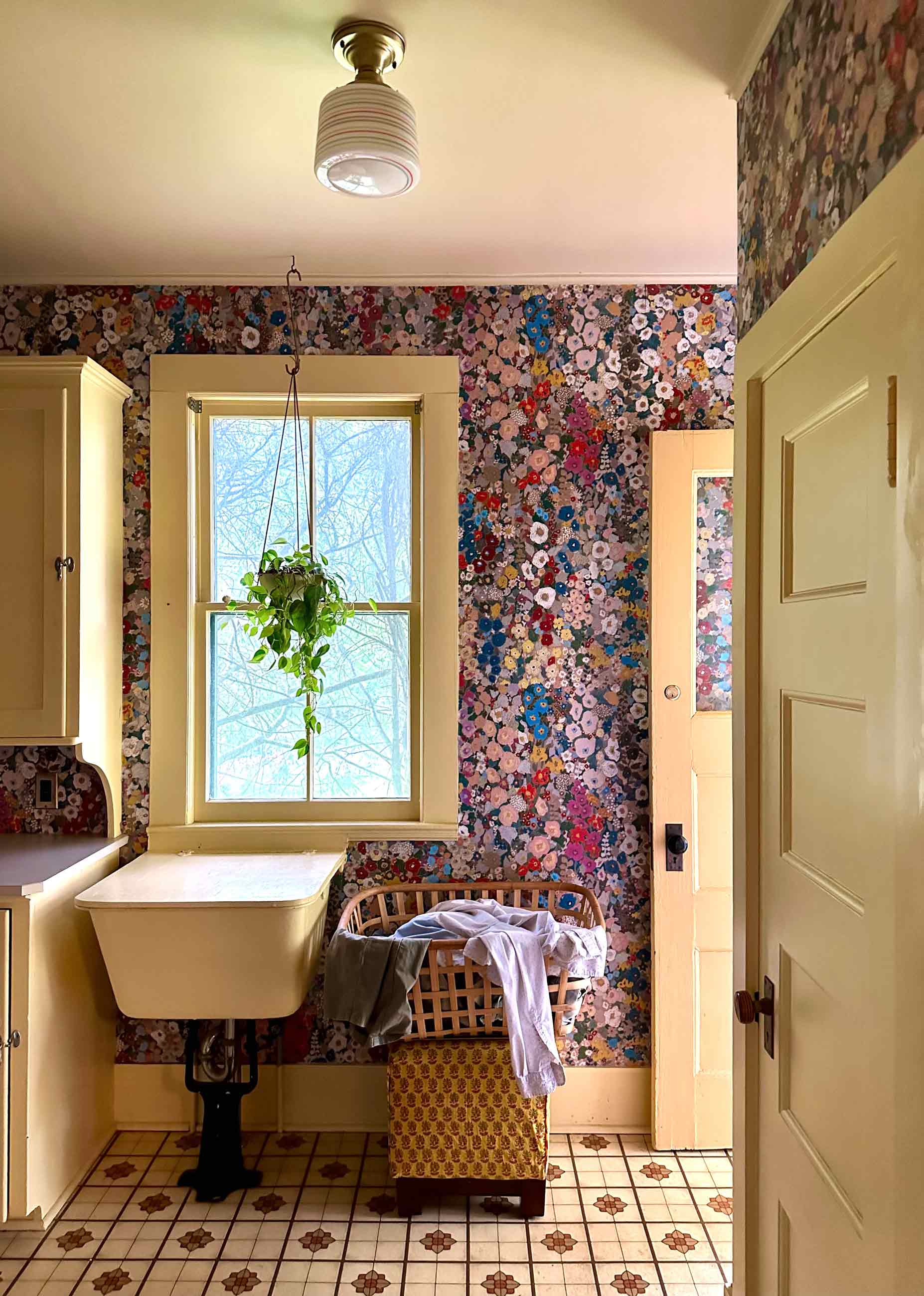 Floral wallpapered laundry room.