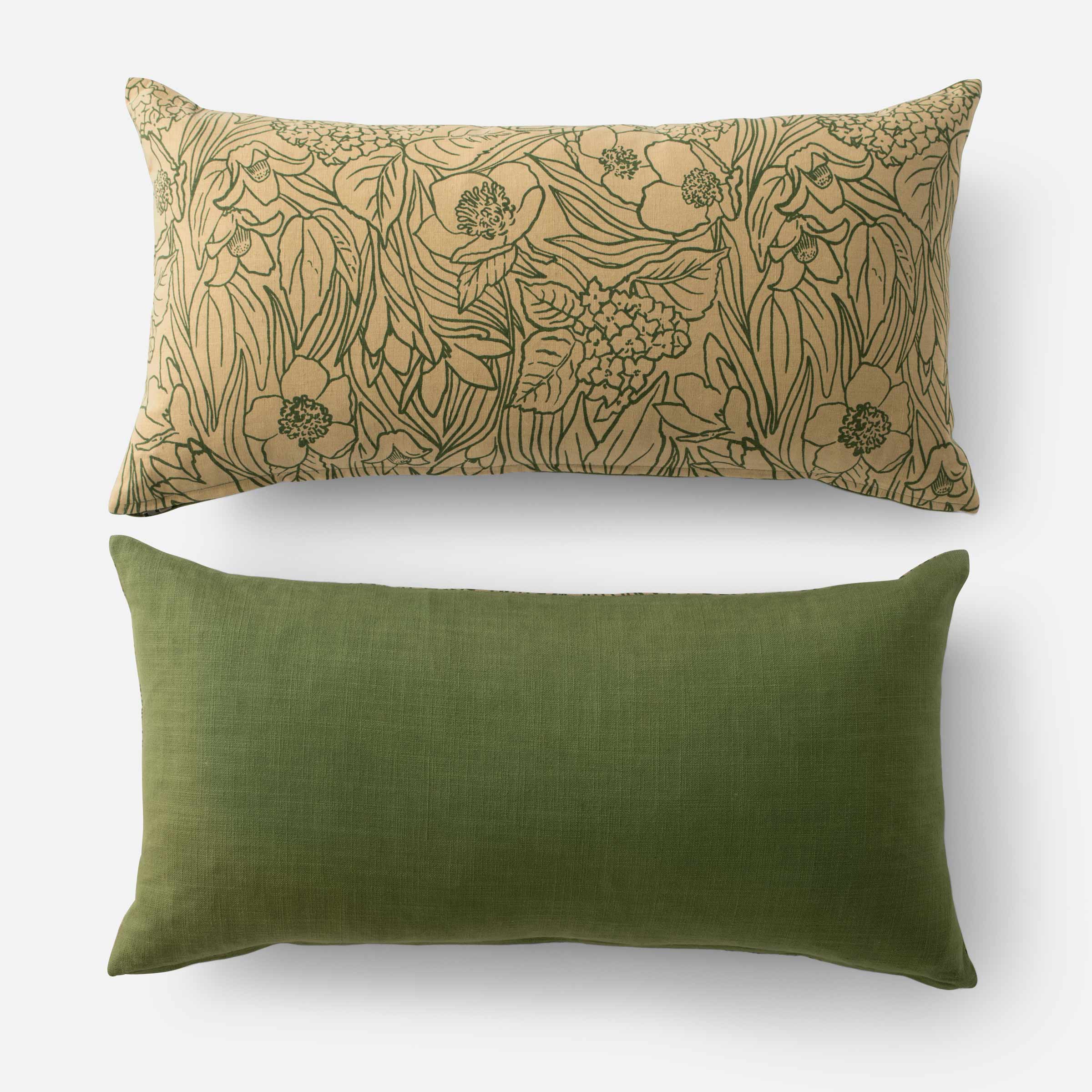 The front and back covers of a green, floral print lumbar pillow.