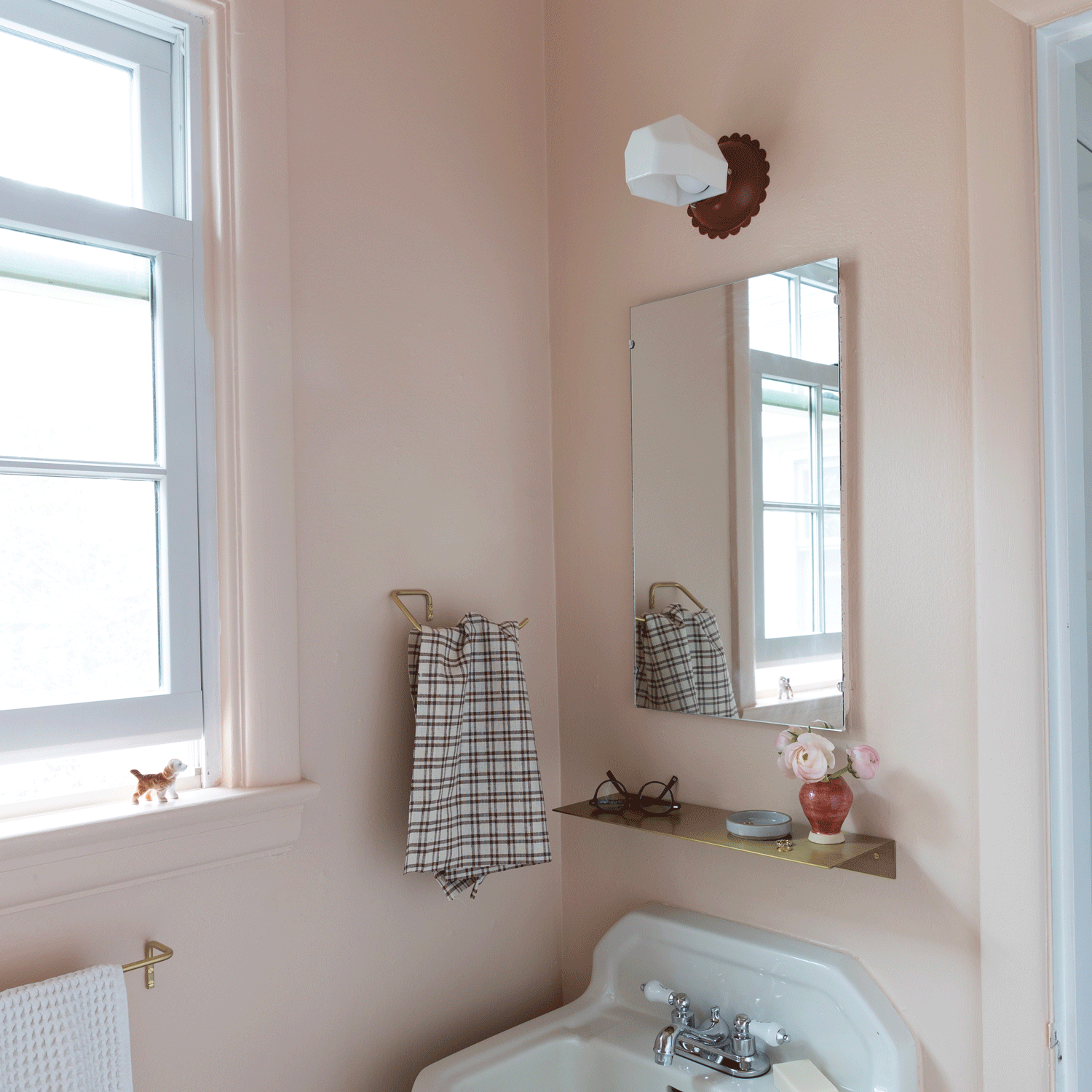 Fran wall sconce in a small bathroom.