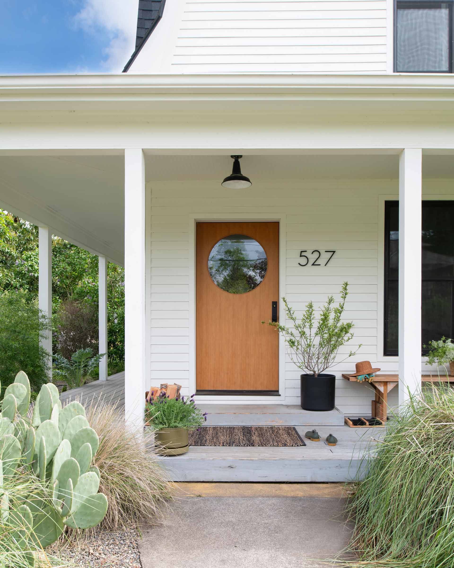 A modern front porch with a surface mount light.