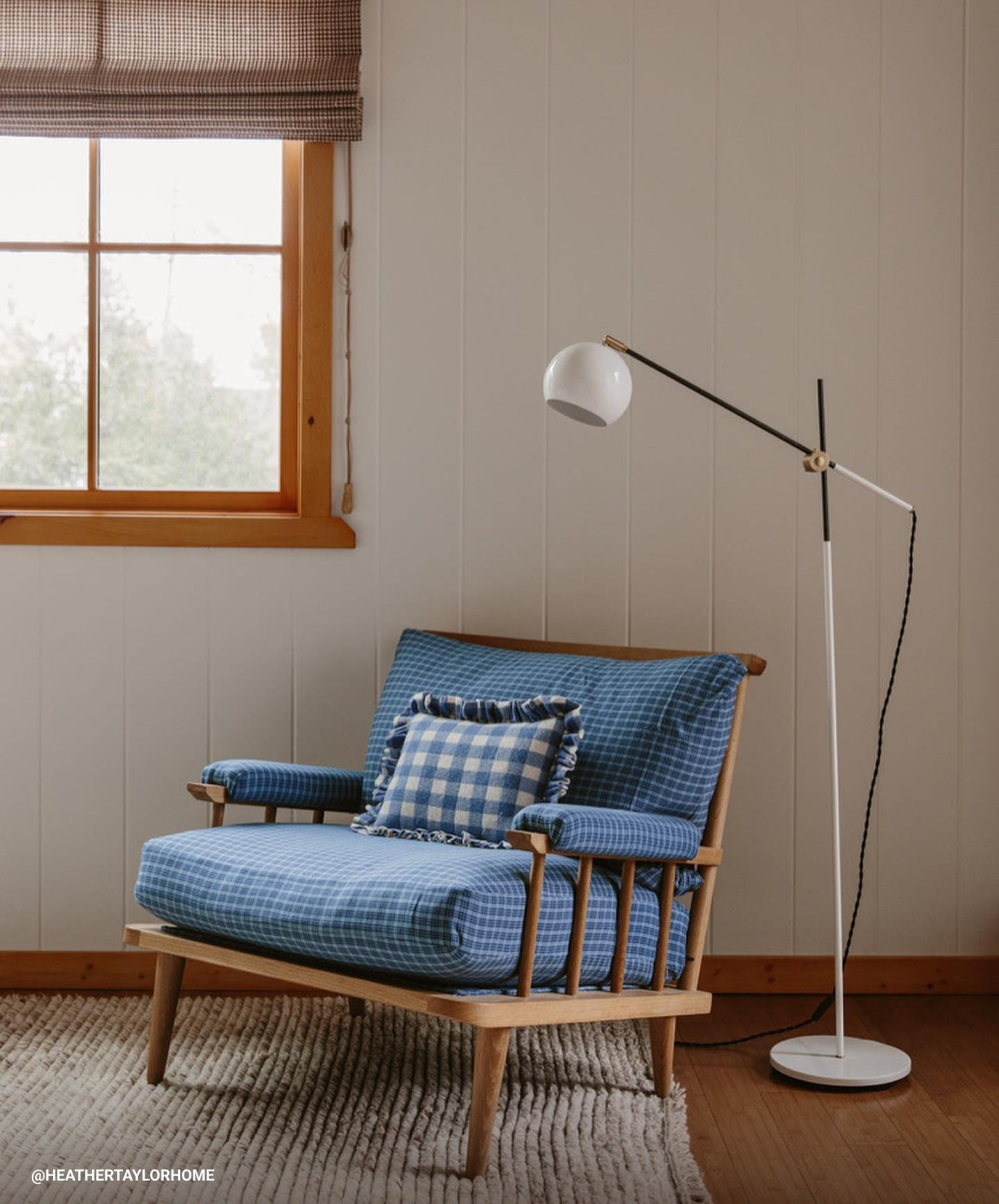 An Isaac floor lamp by an accent chair via @heathertaylorhome.