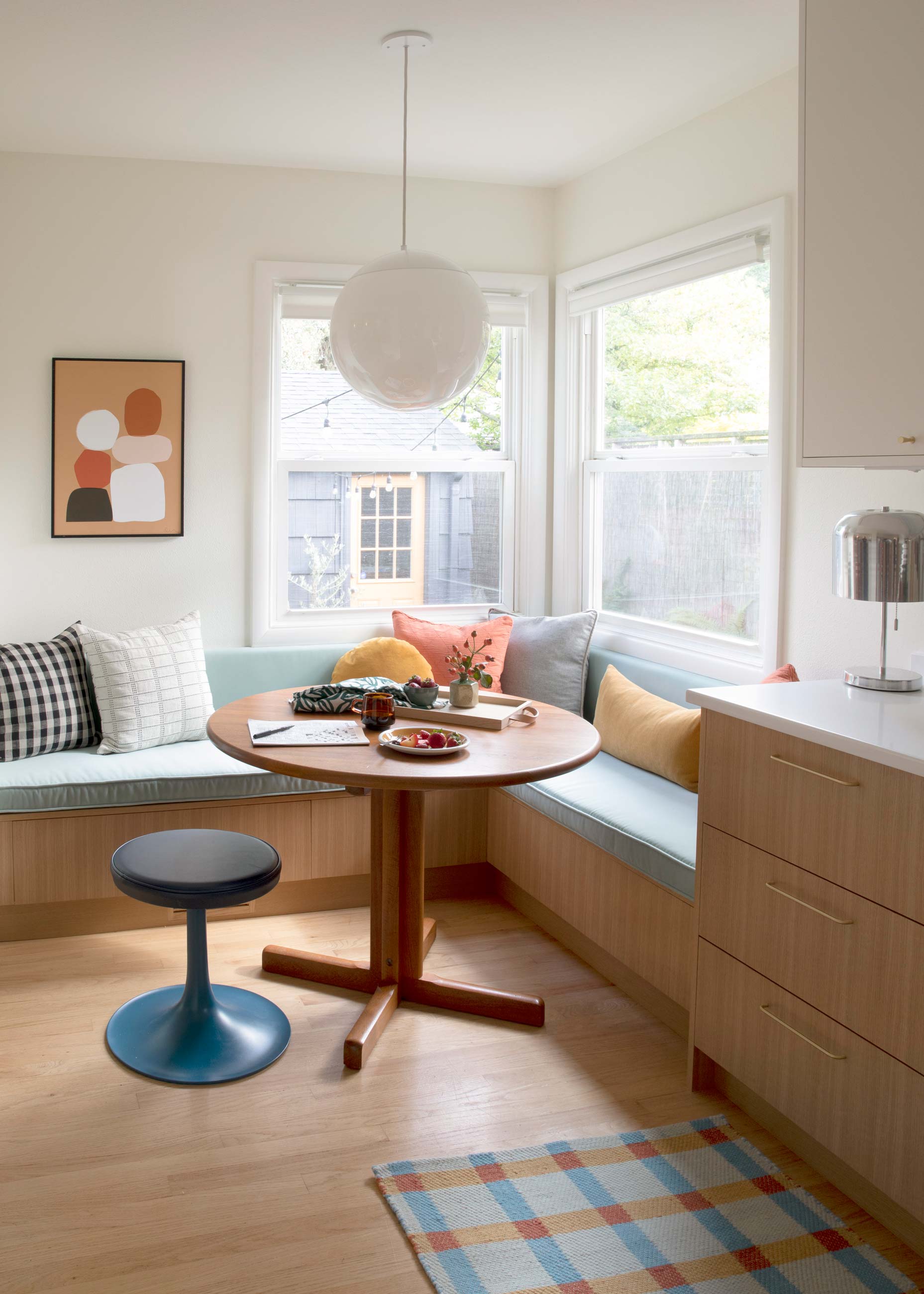 Dining room kitchen nook with globe pendant. 