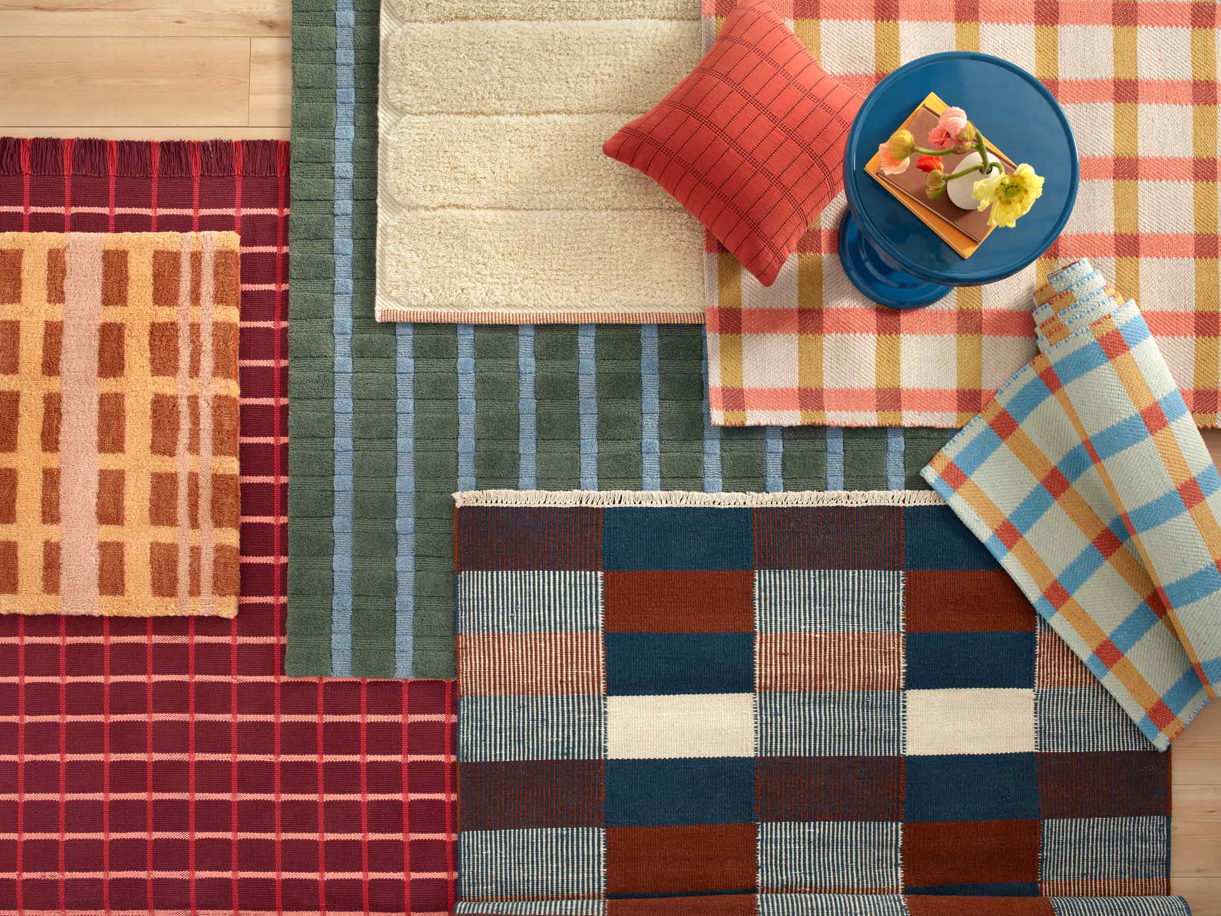 Cozy, vibrant rugs layered on top of each other.