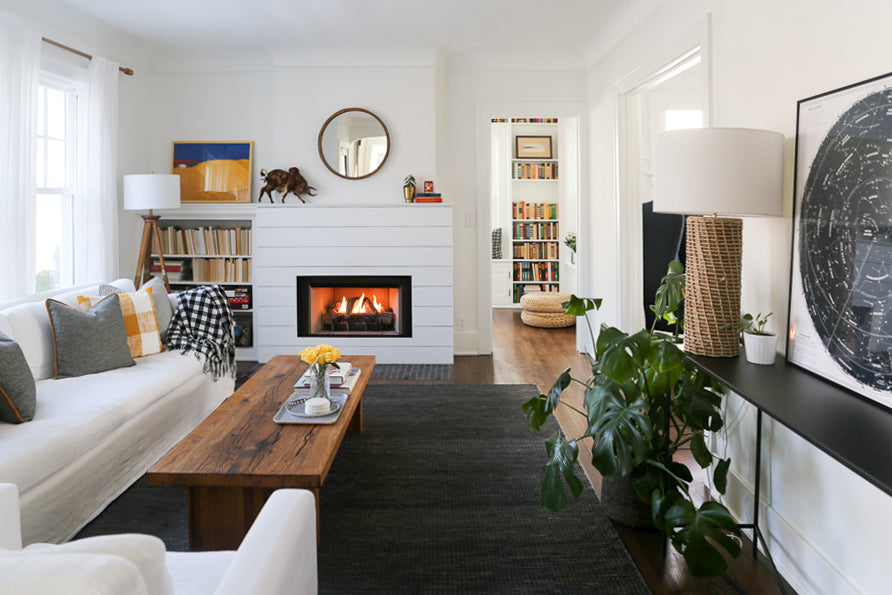 living room with a fireplace and a white couch