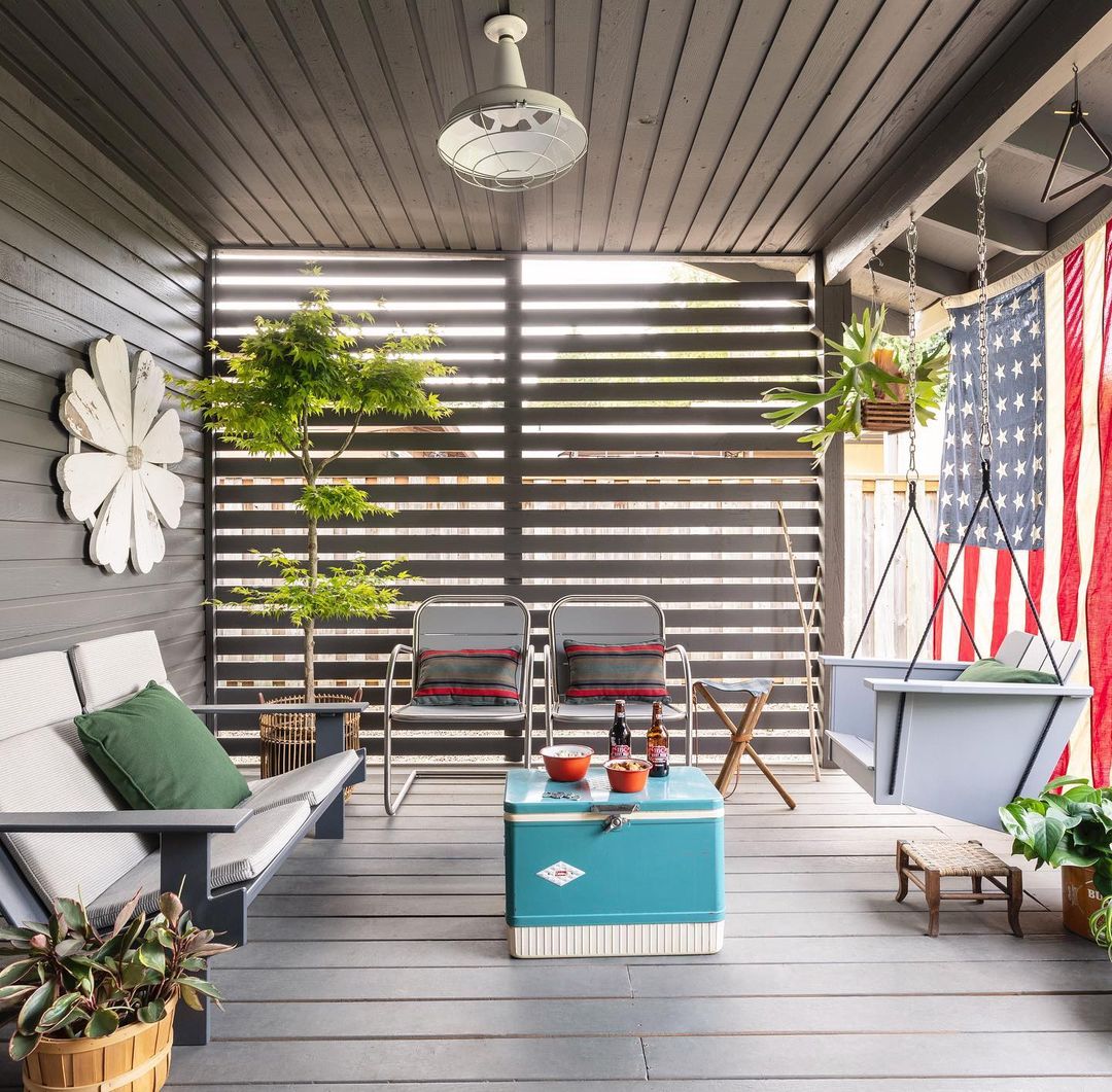 patio with a table and chairs and an American flag hanging