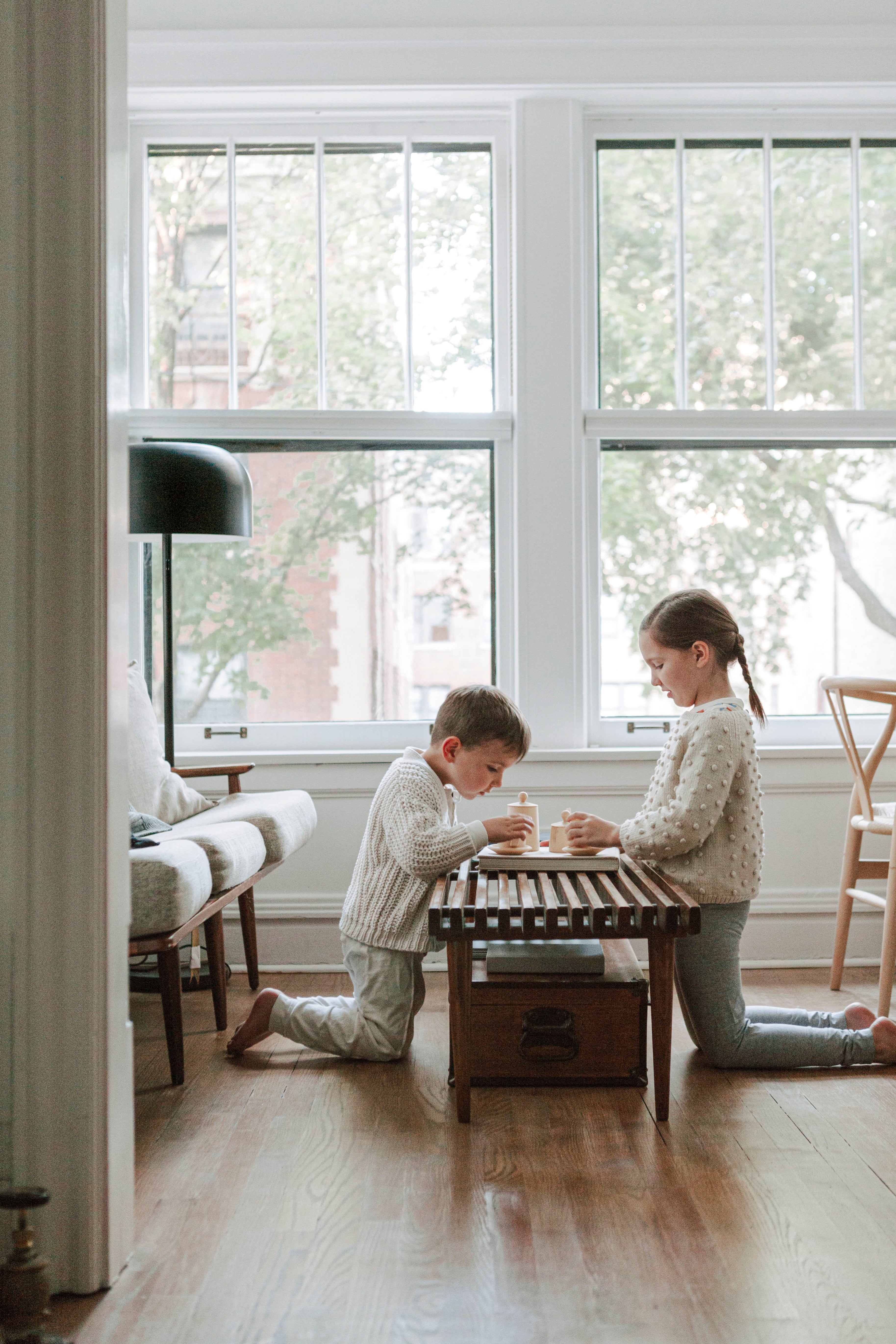 two kids playing in a room