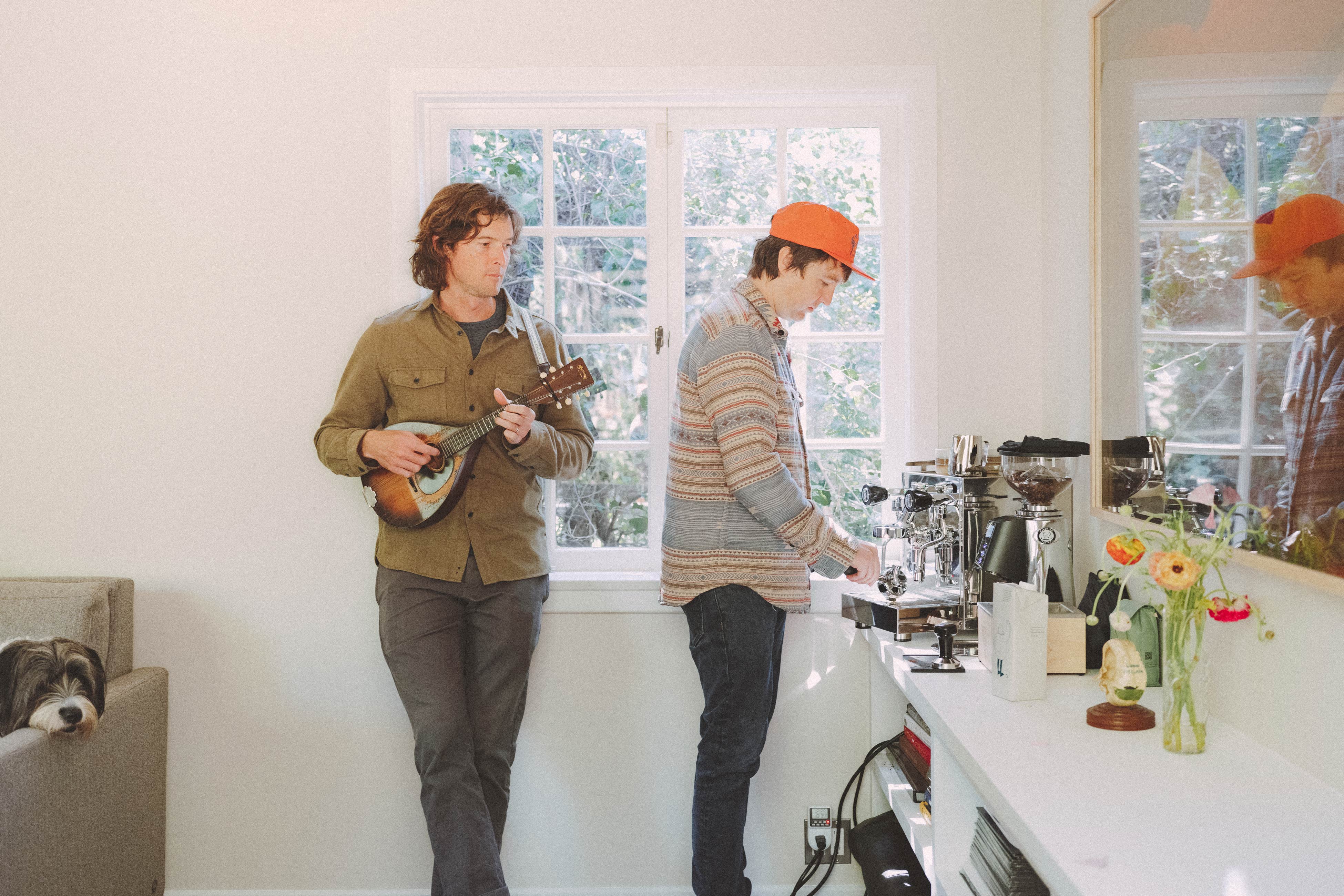 Milk Carton Kids in kitchen making coffee and playing the ukelele. 