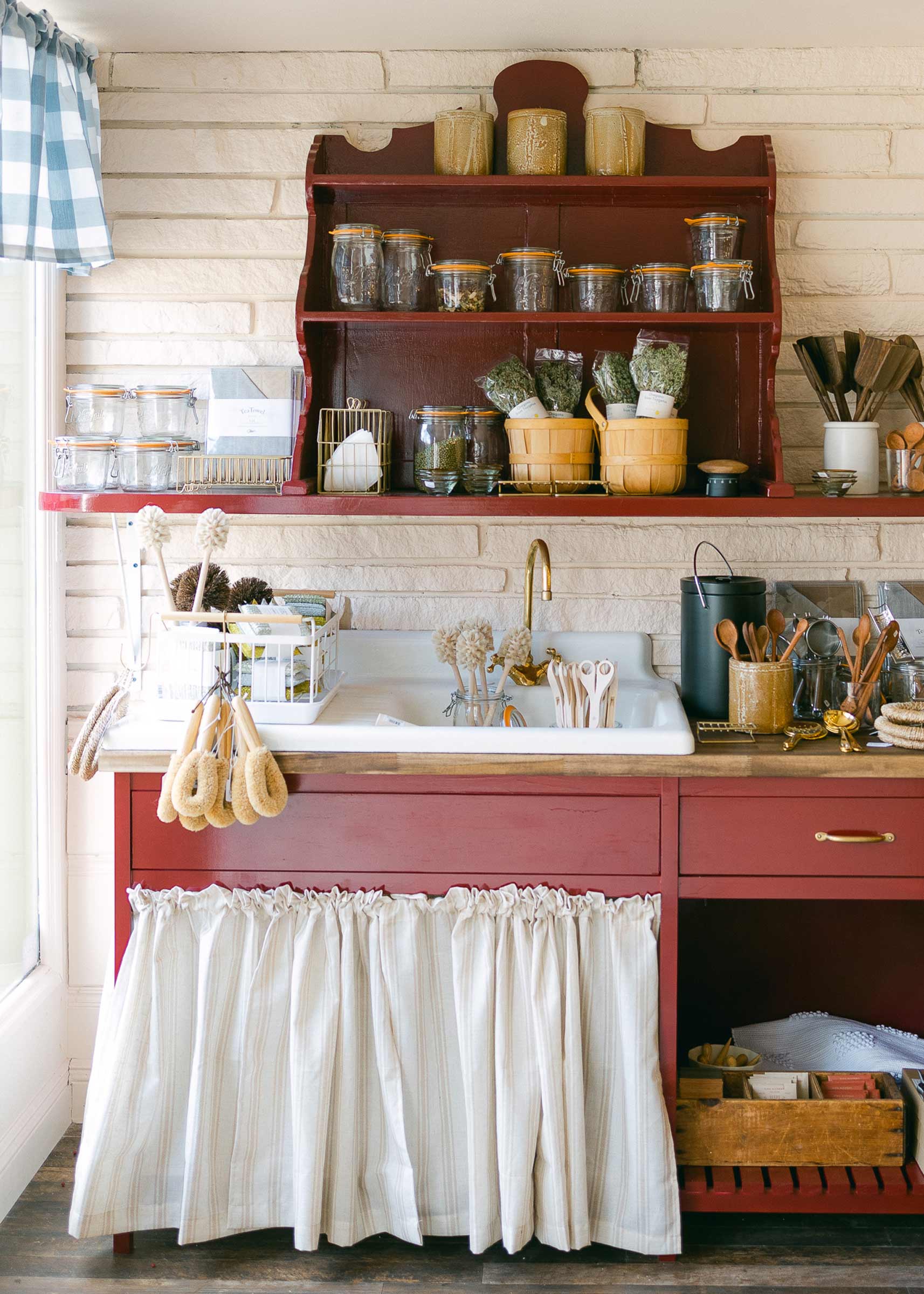 A quaint kitchen with stocked shelves at the Neighbors General Store. 