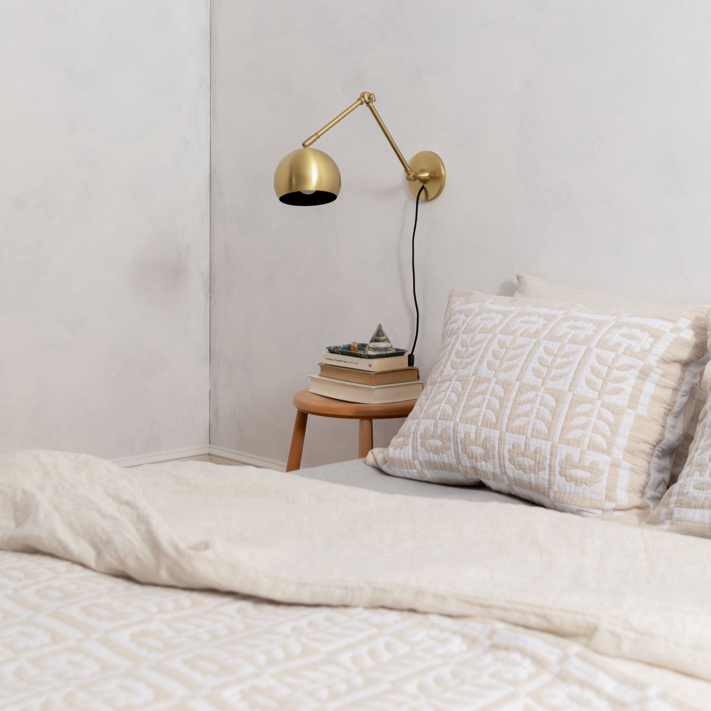 Neutral floral bedding in a modern bedroom.