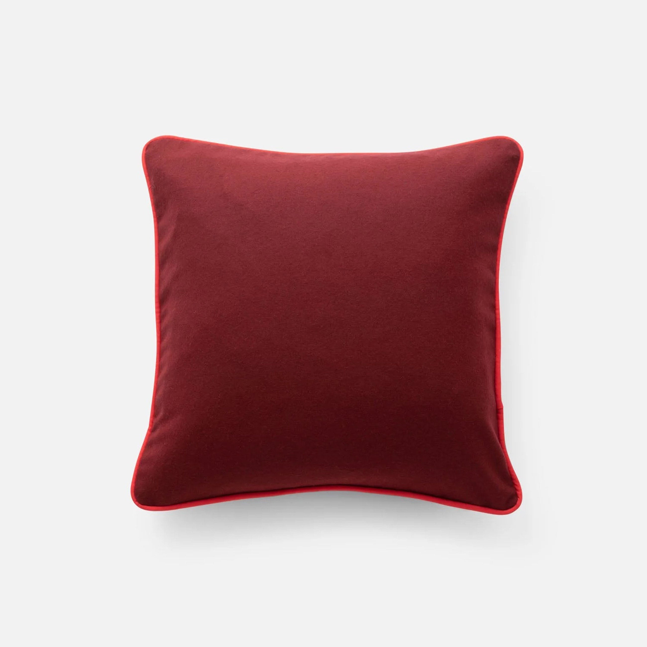 Classic piped pillow in Berry.