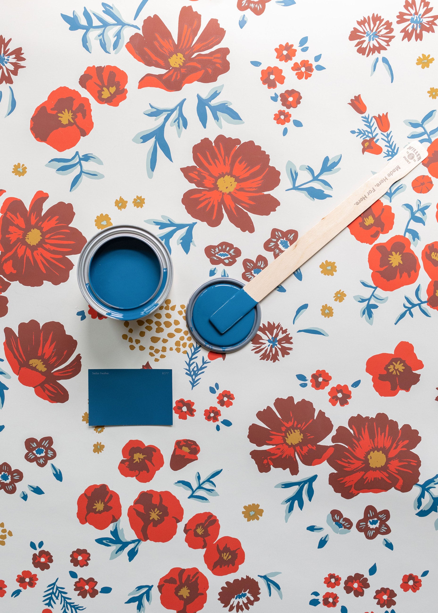 Floral wallpaper and blue paint.