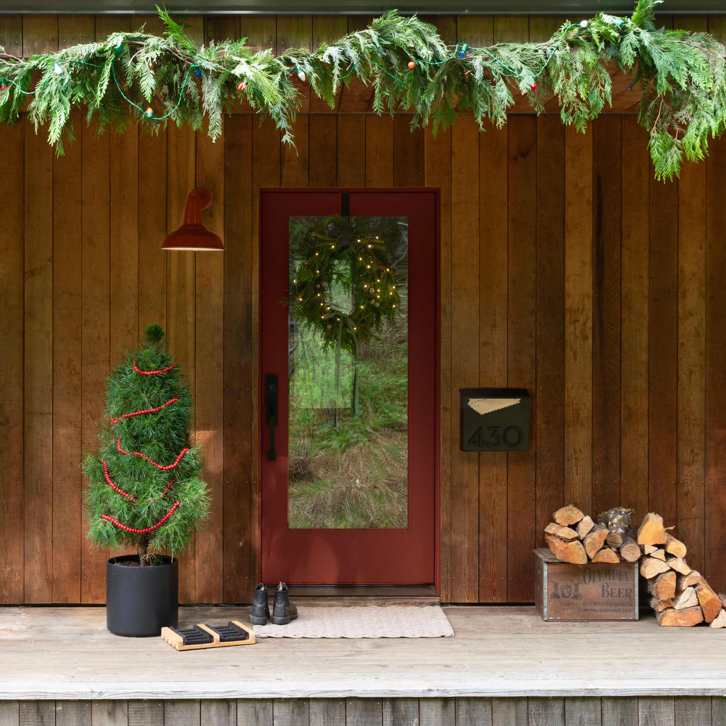 Red wall sconce on a front porch.