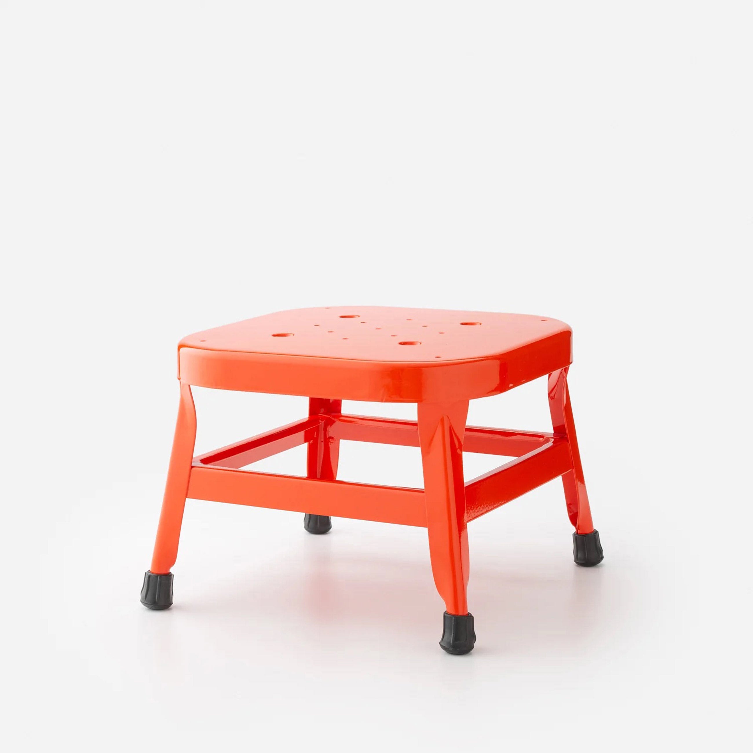 Red utility stool product photo. 