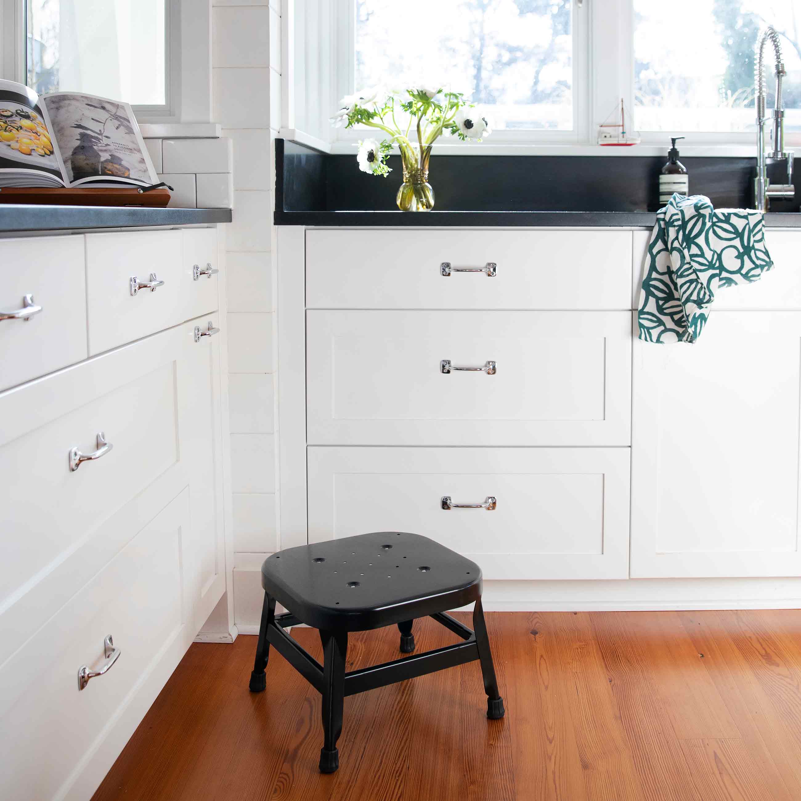 Black stool in kitchen.