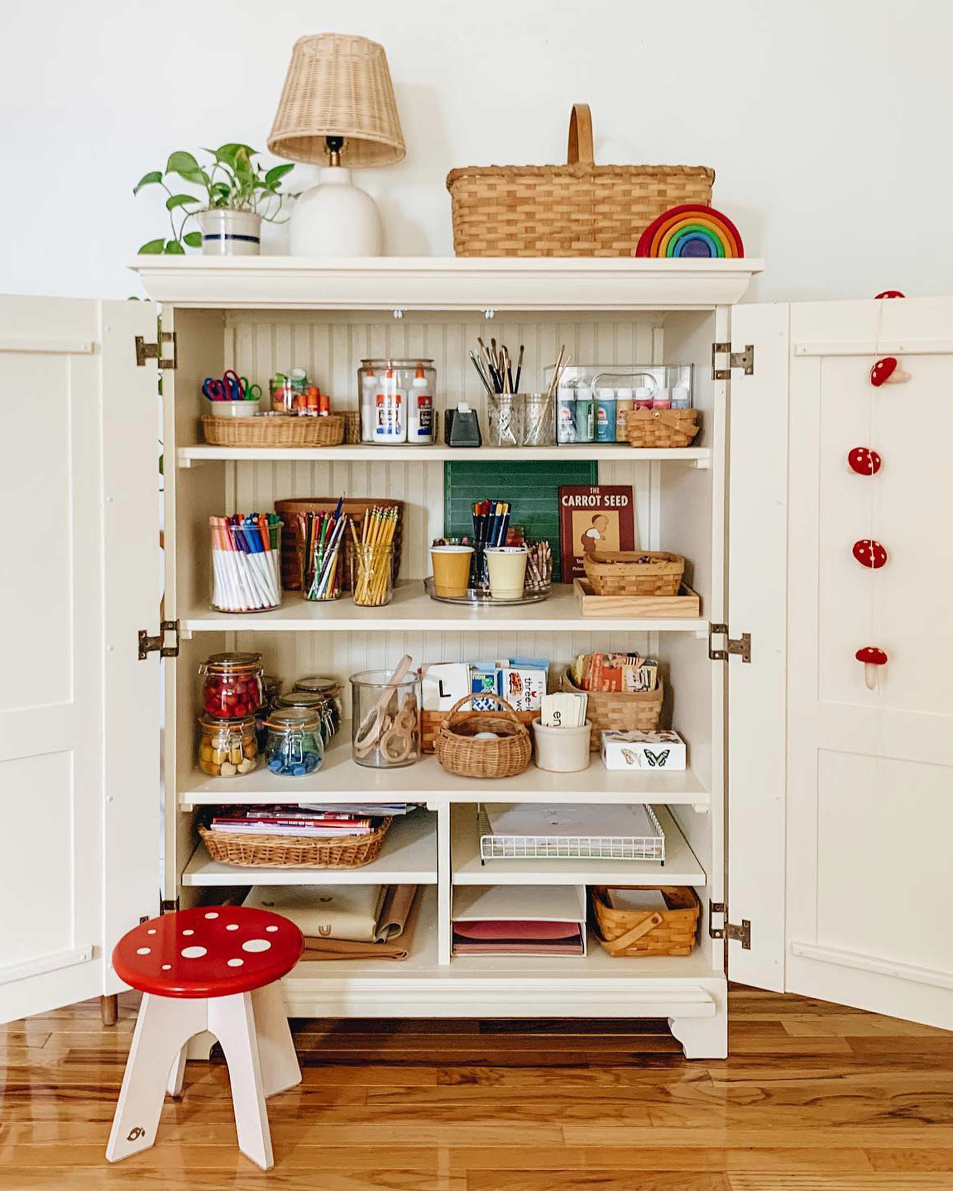 Storage and craft supplies organized in a kid's room. 