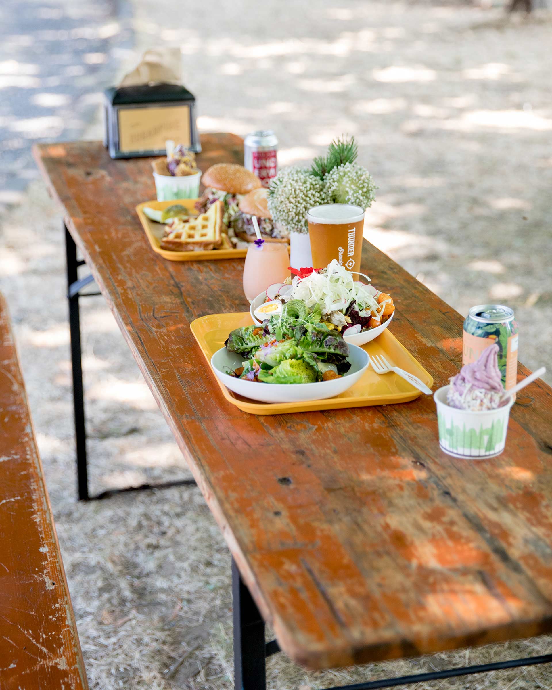 A wide array of seasonal dishes on a bench at Sugarpine Drive-In. 