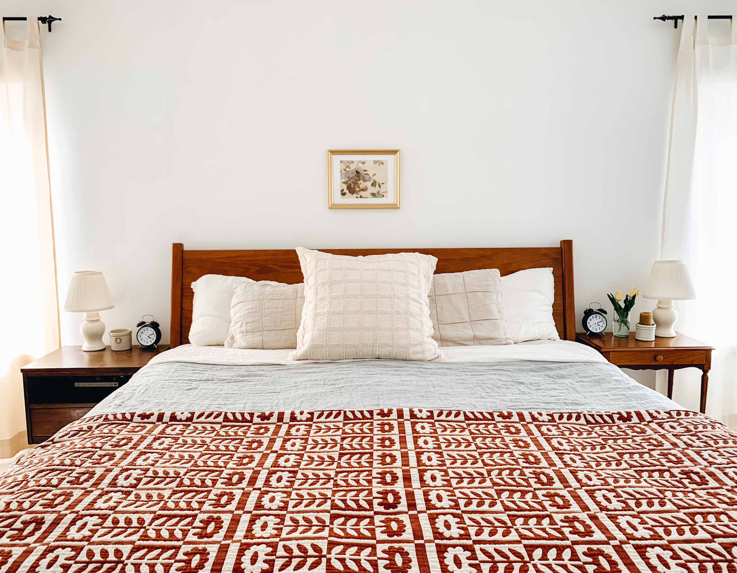 The Stillwater Floral Quilt in a cozy bedroom. 