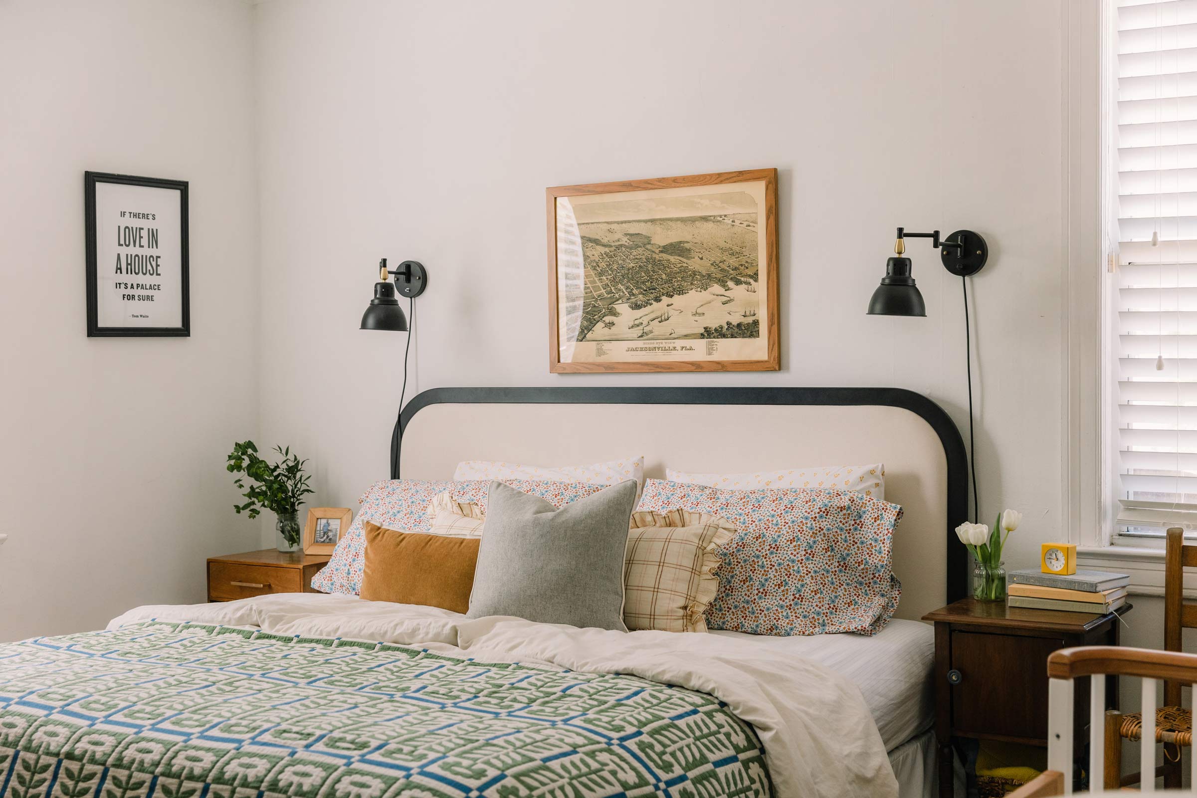 The Stillwater Floral Quilt on a vintage-inspired bed. 