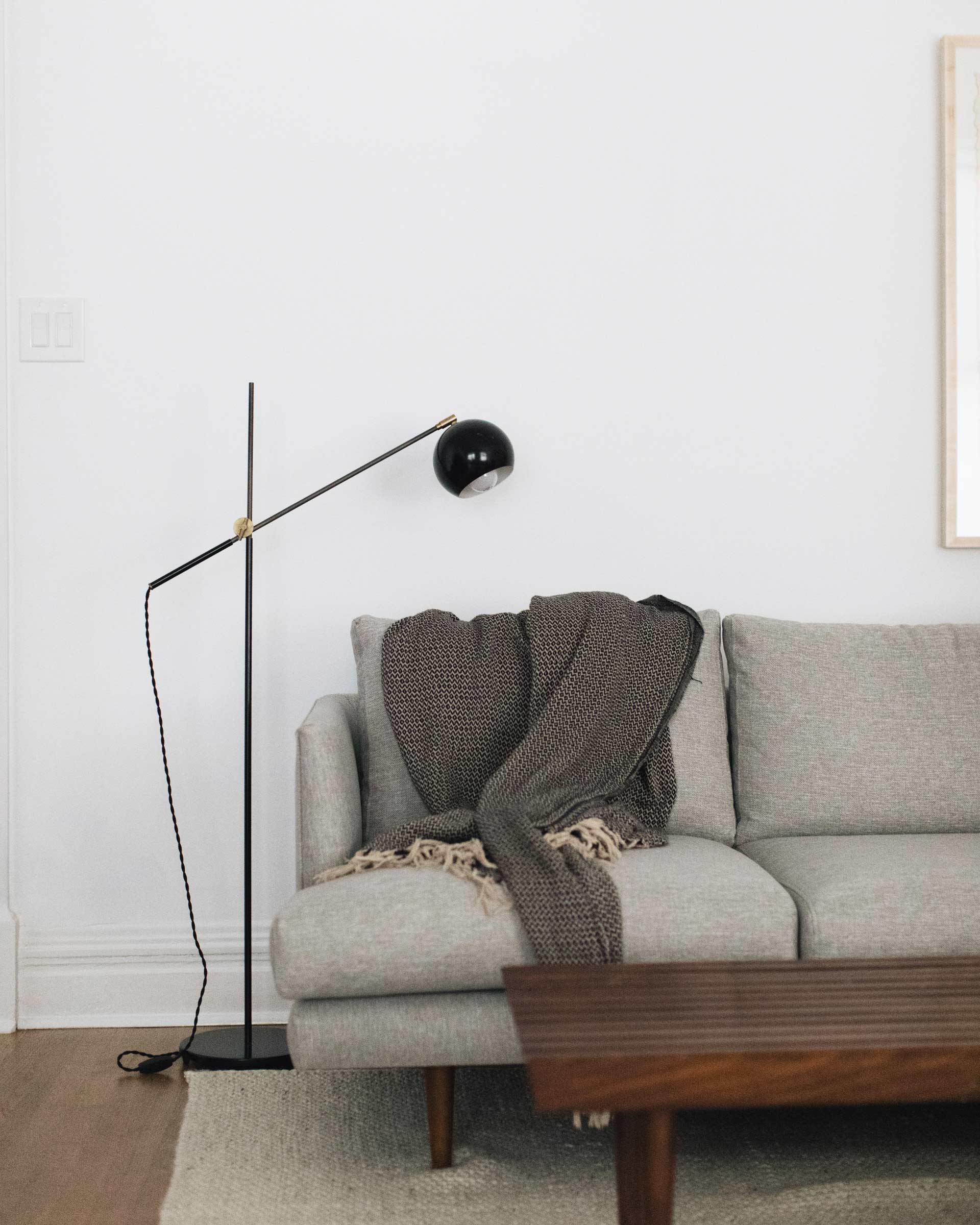 The Studio Floor Lamp in Black in an apartment. 