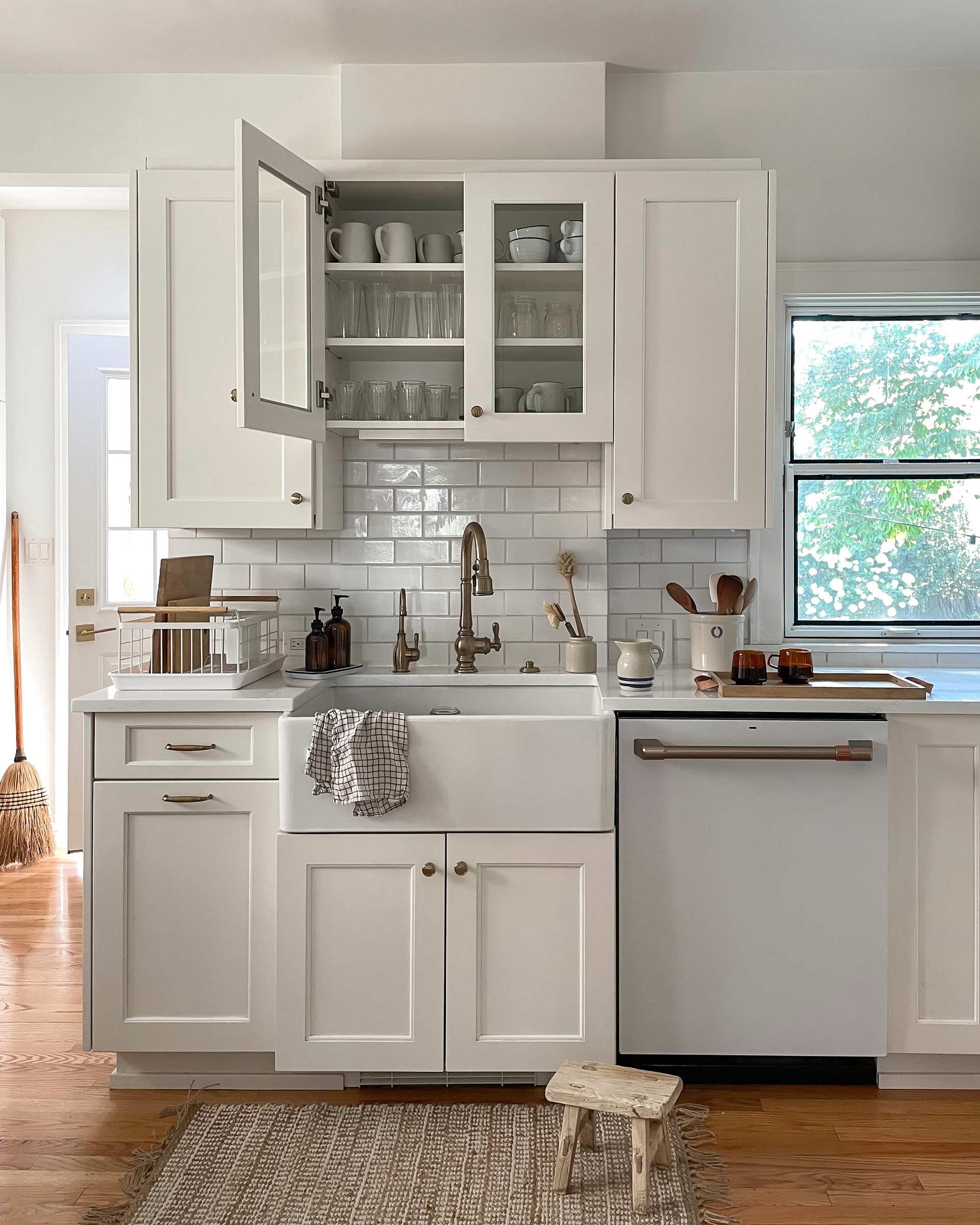 Heritage-inspired kitchen with a large, low sink and a jute rug.