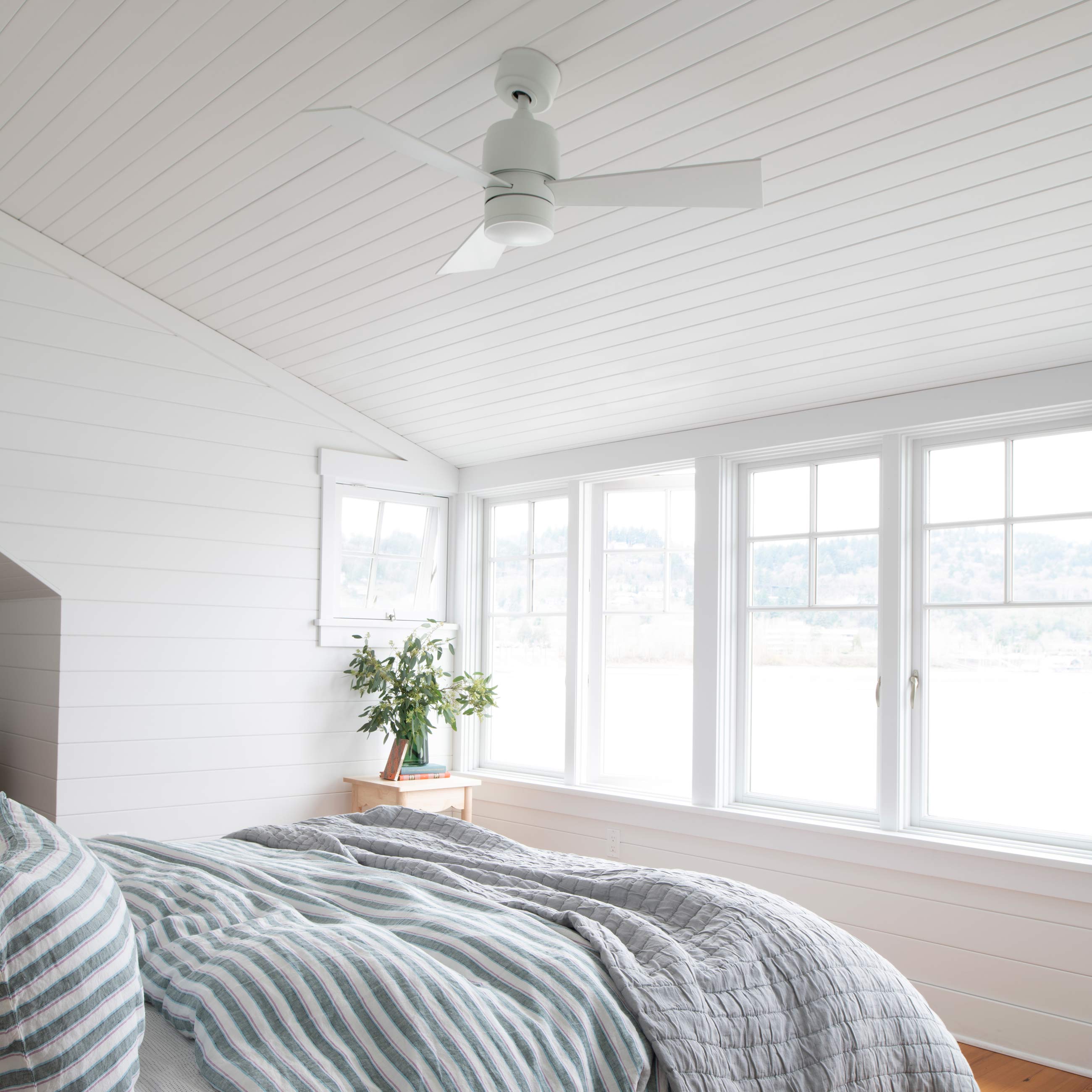vaulted ceiling fan in bright bedroom