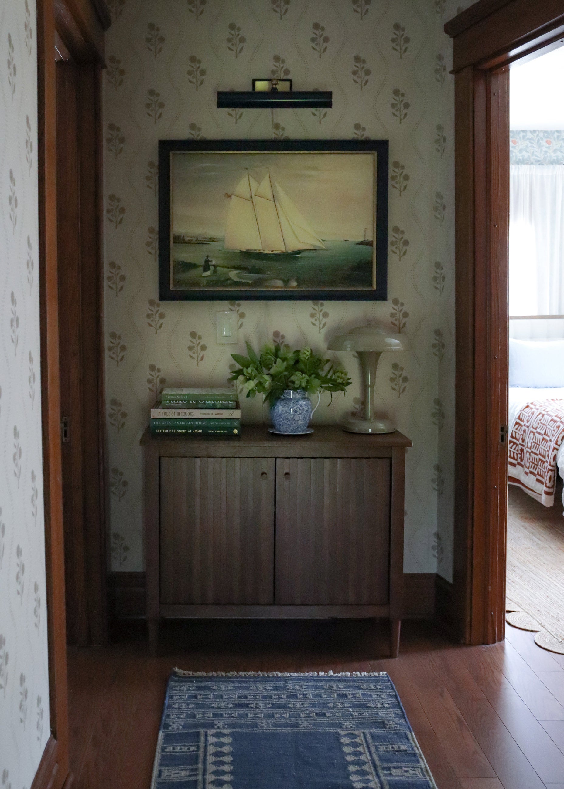 Wallpapered hallway in a traditional style home.