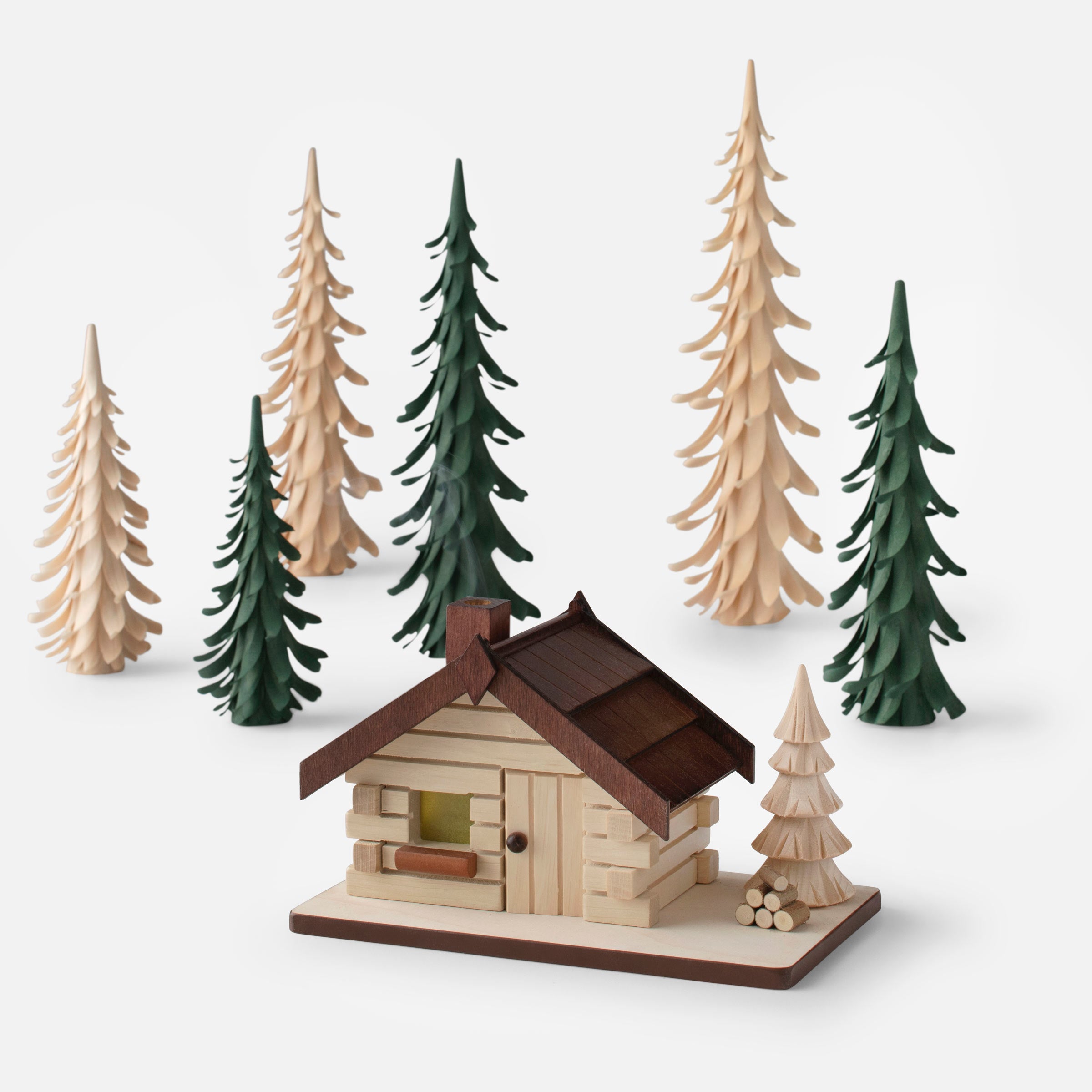 Wooden tree holiday decor and a cabin incense smoker set.