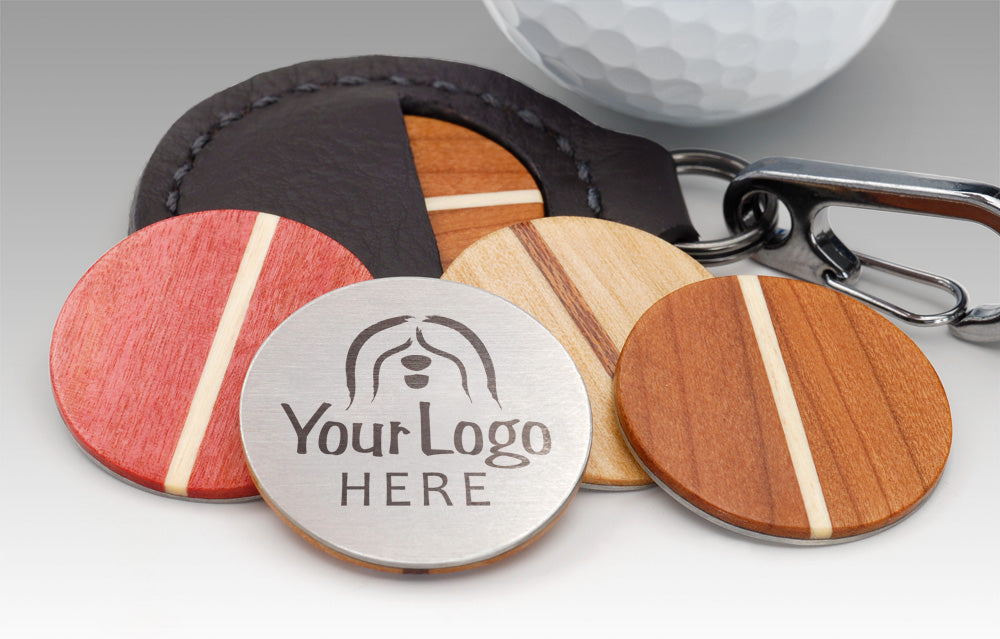 Custom laser-engraved wood golf ball marker in cherry maple pink ivory wood
