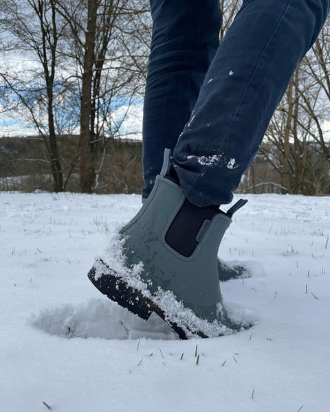 A person wearing Bobbi gumboots and standing in the snow