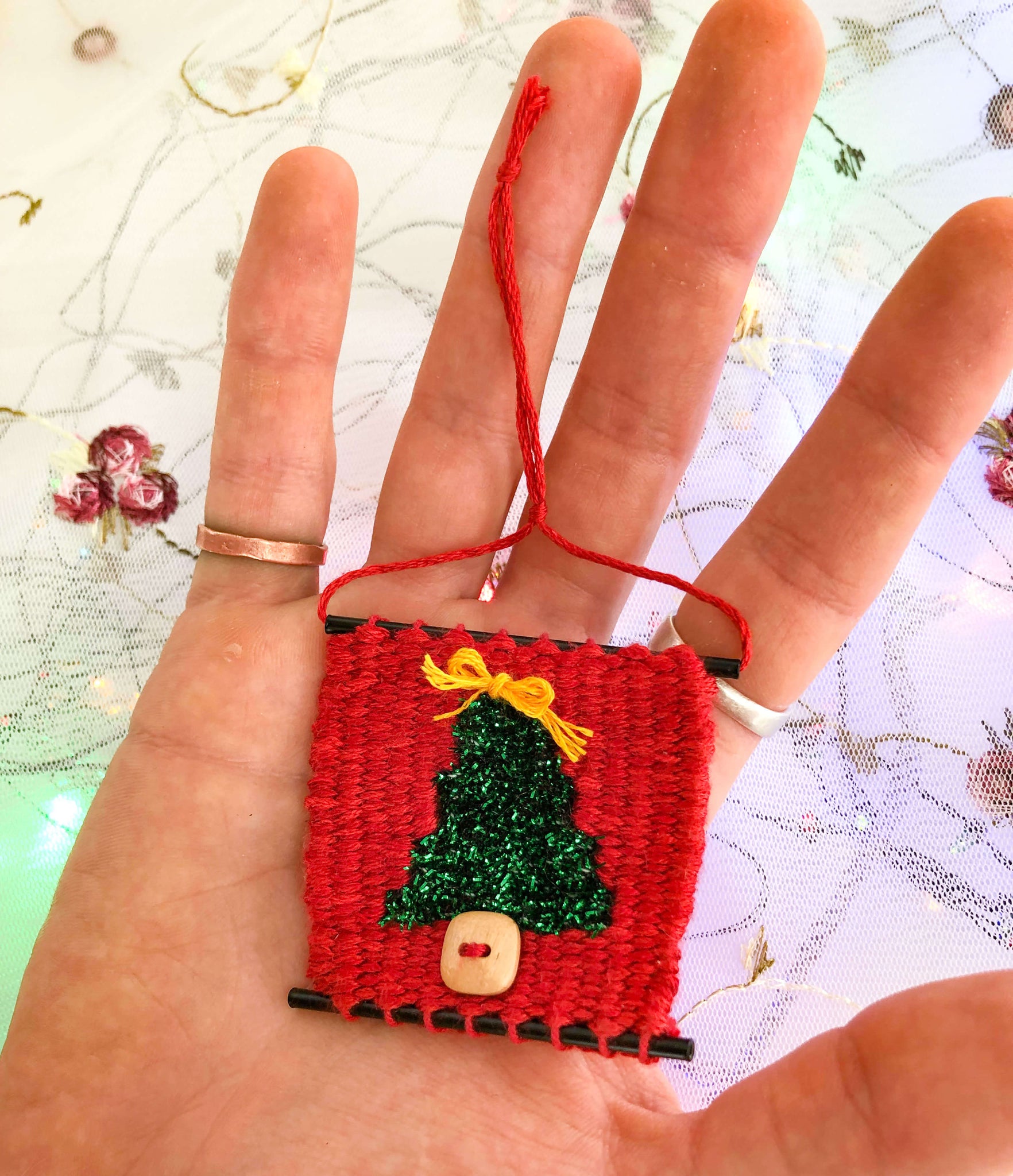 Handwoven Christmas Tree Ornament in hand