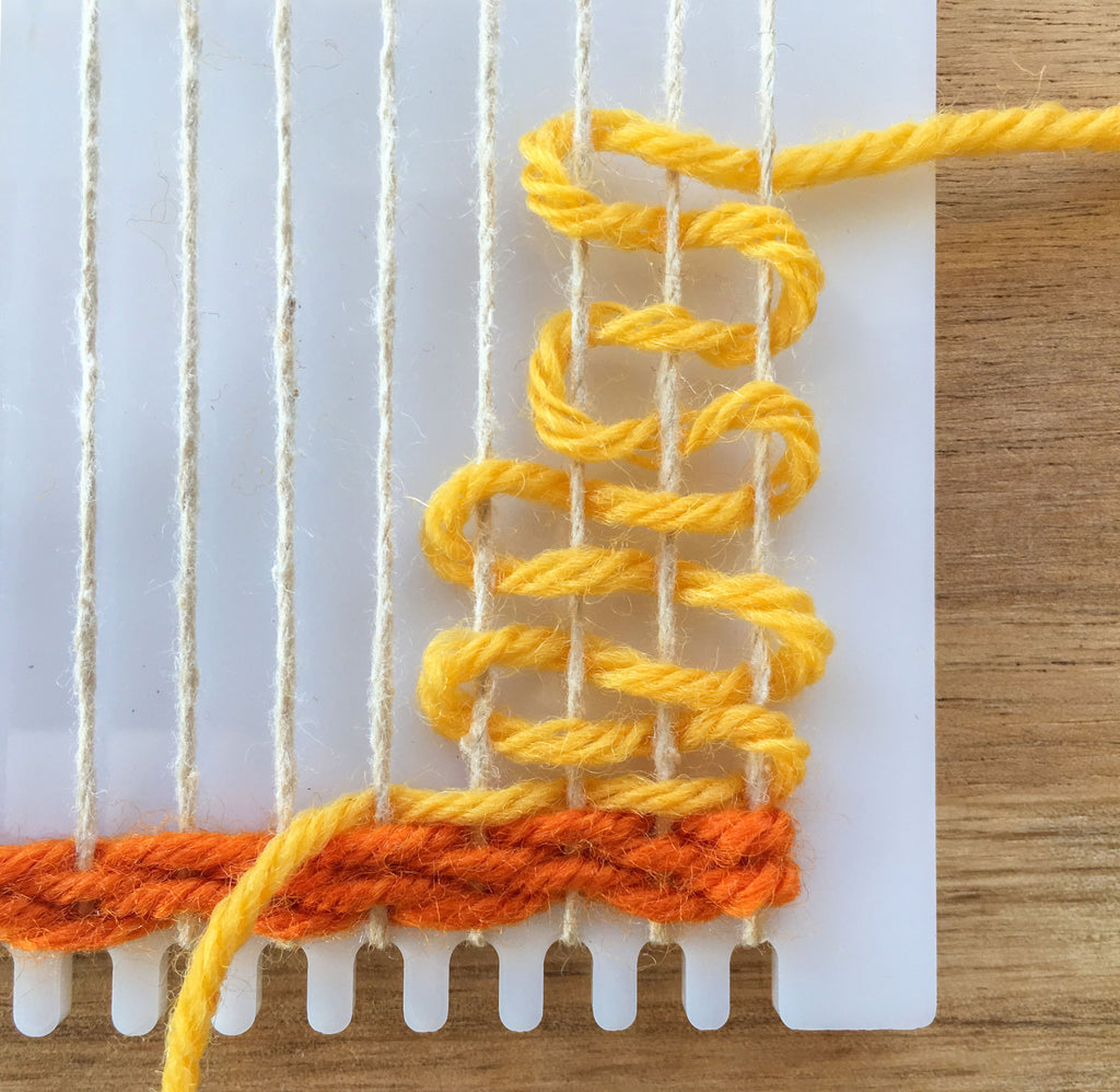 Begin to weave a shape on a frame loom.