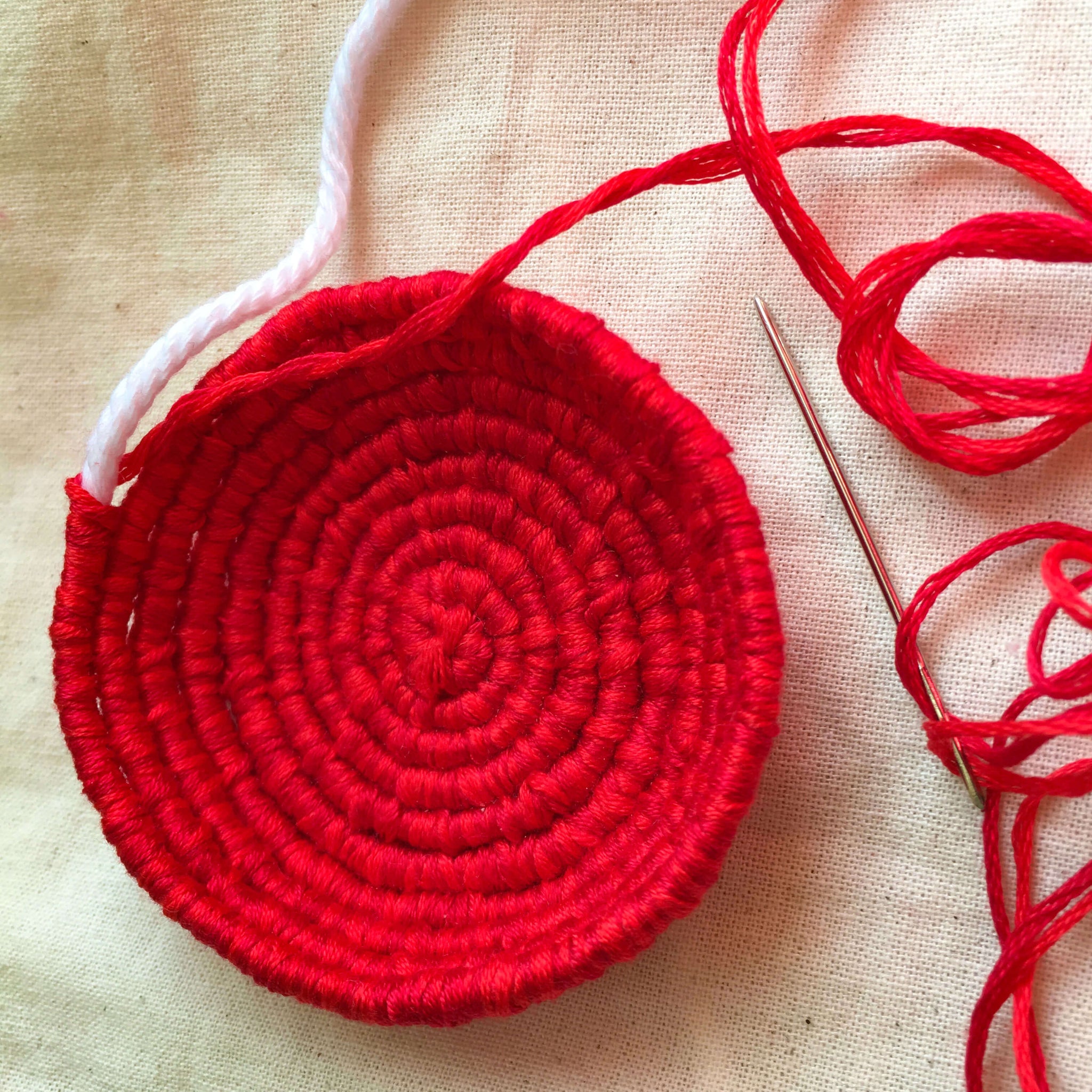red coiled mini basket in process