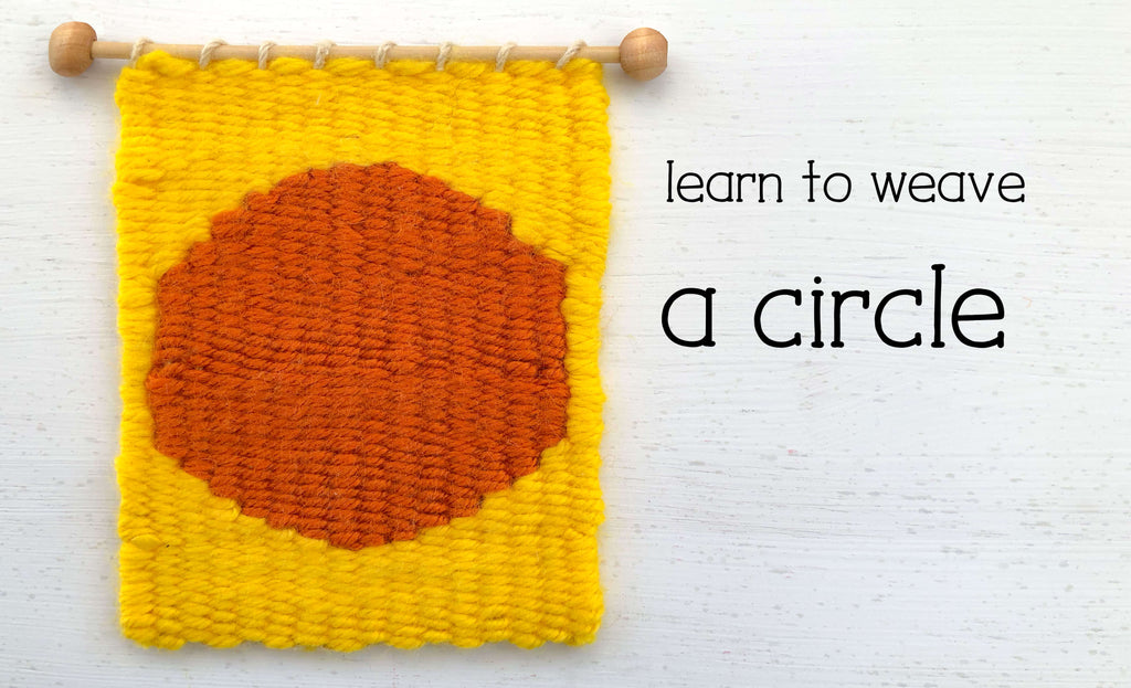 yellow handwoven wall hanging with an orange circle