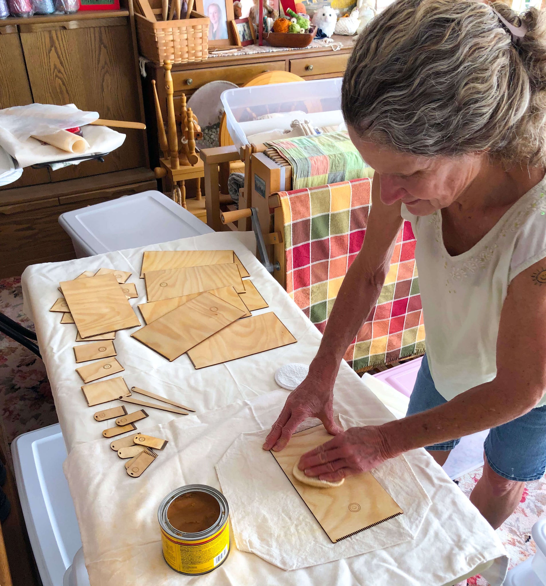 waxing the wooden looms