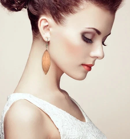 Elegant Female Model in White Dress Wearing Copper Bark Leaf Drop Earrings